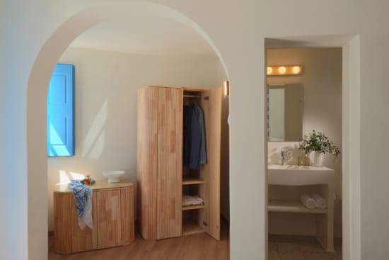 a room with a closet and sink
