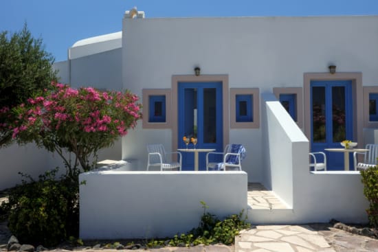 a white house with blue doors