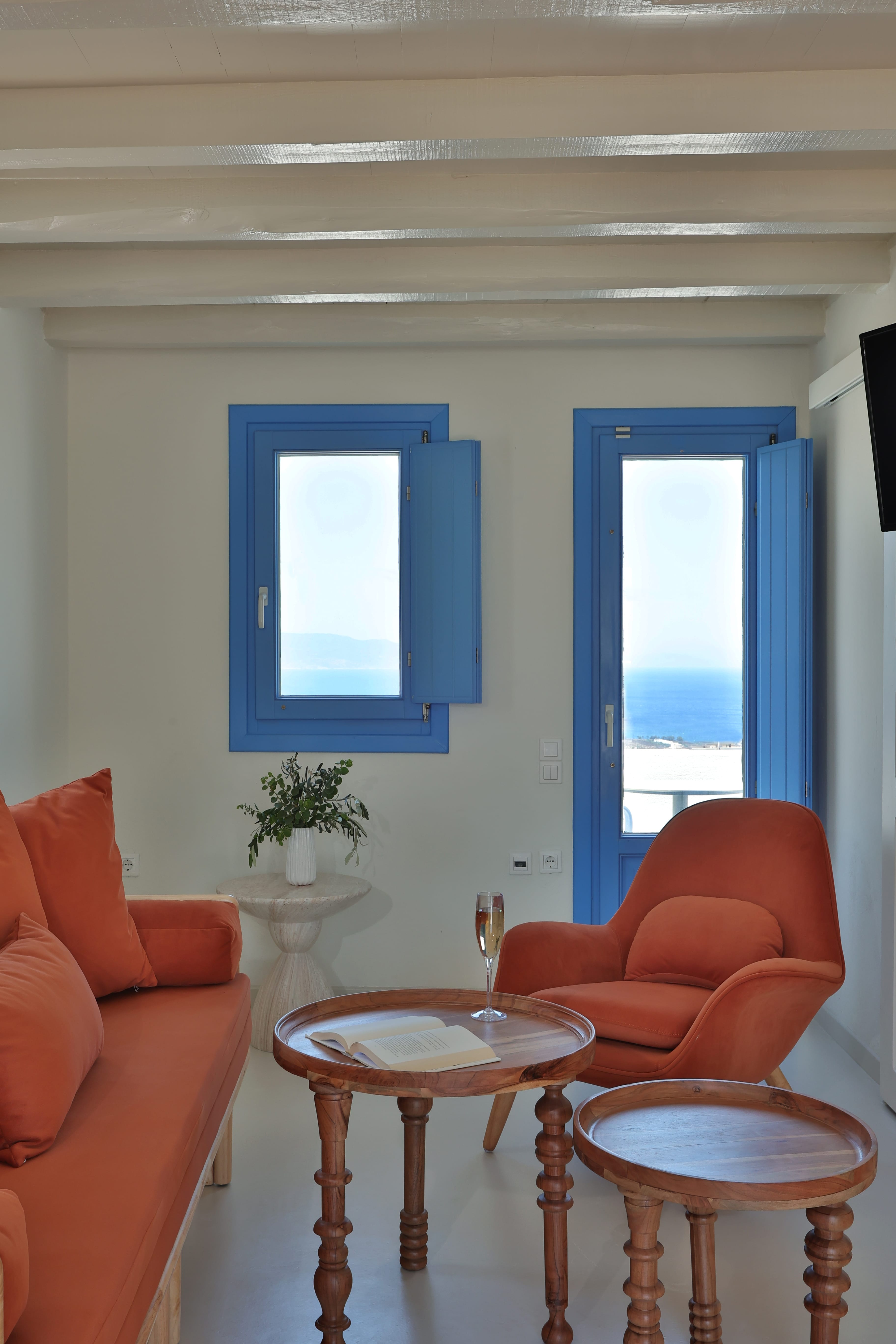 a living room with blue windows