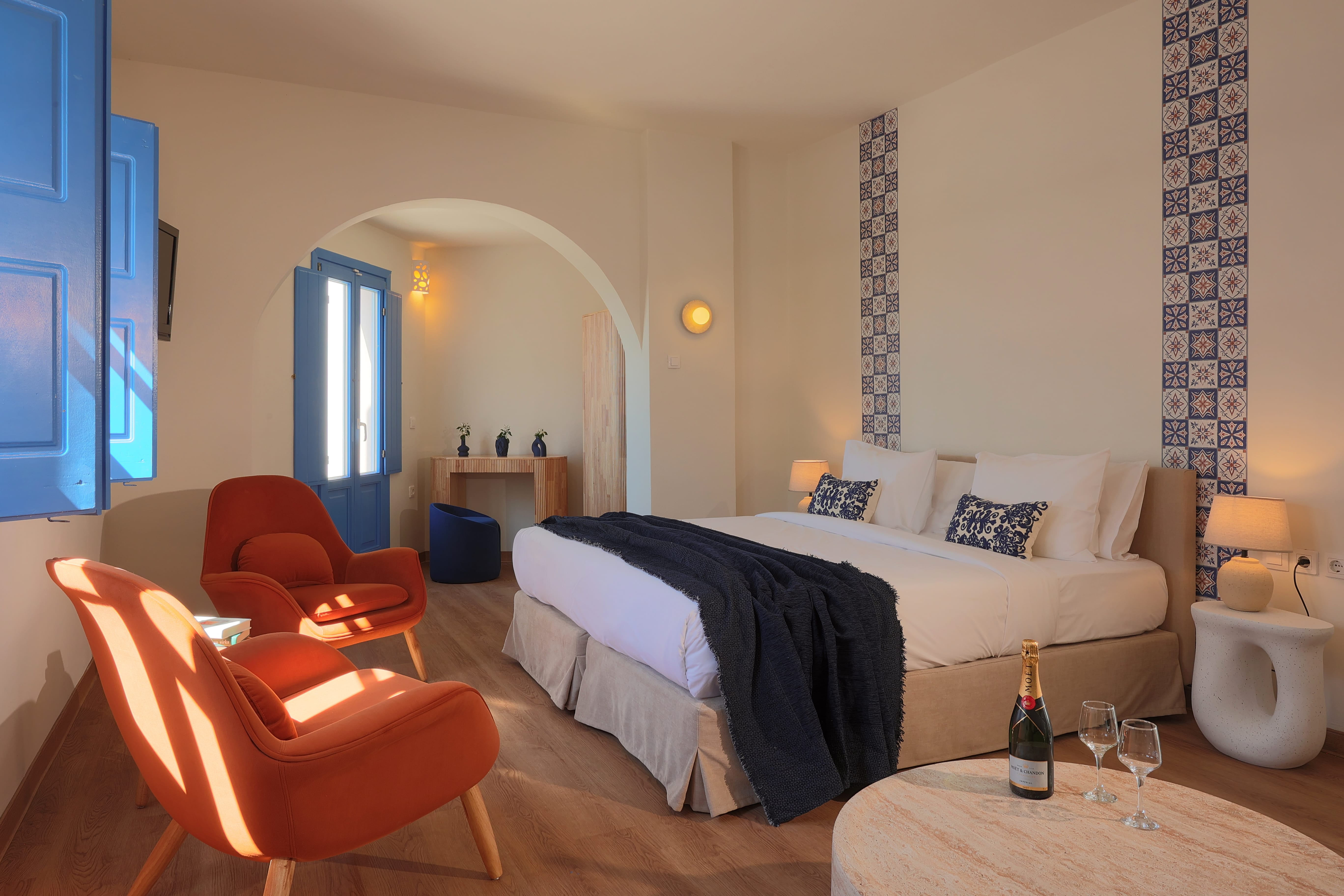 a bedroom with a bed and chair