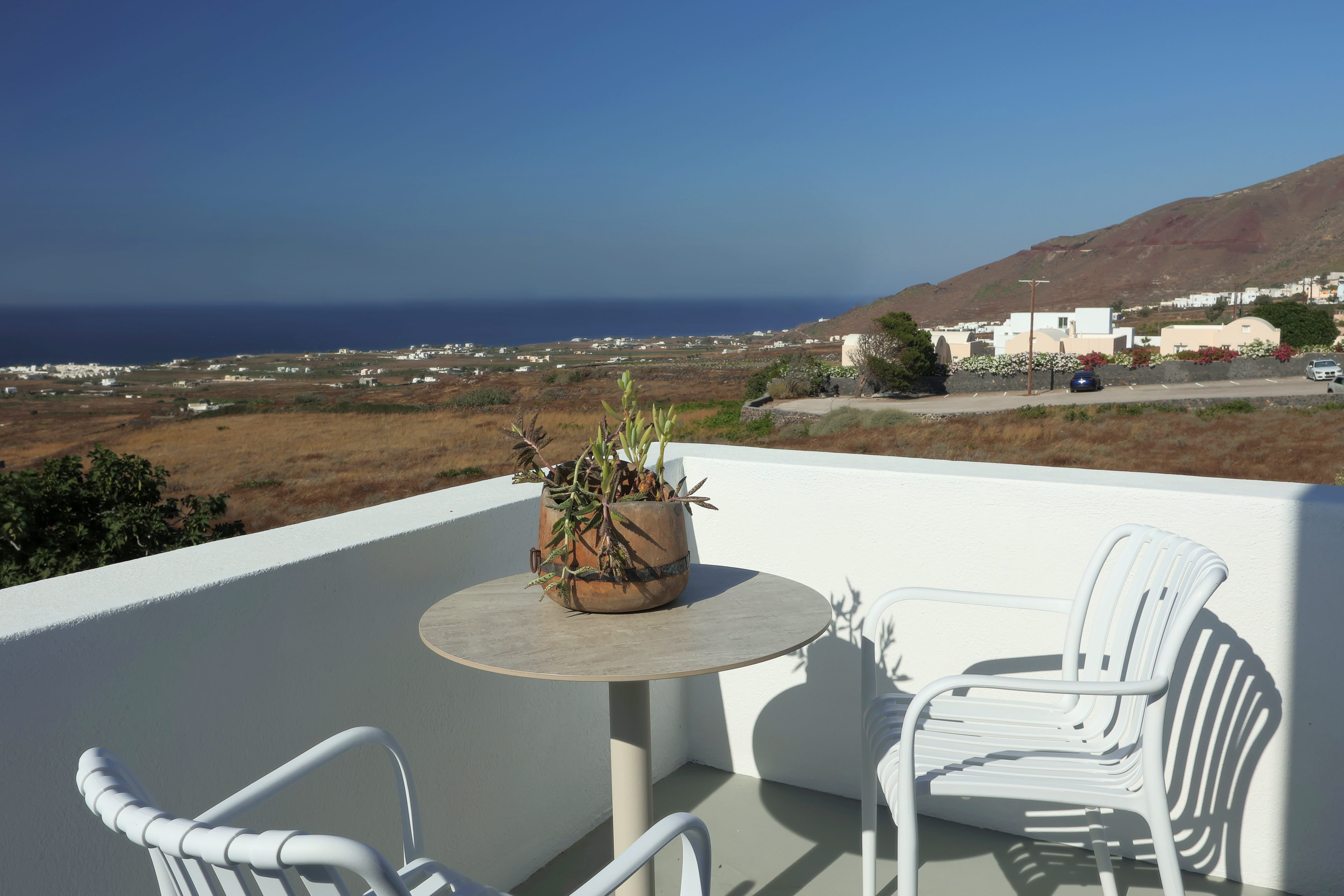 a table and chairs on a balcony
