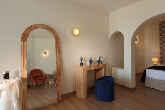 a room with a mirror and a table