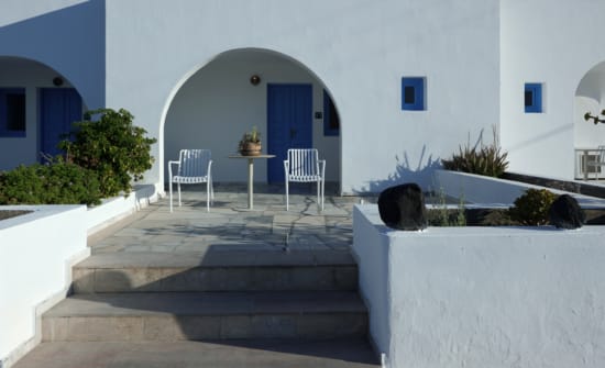 a white house with blue door