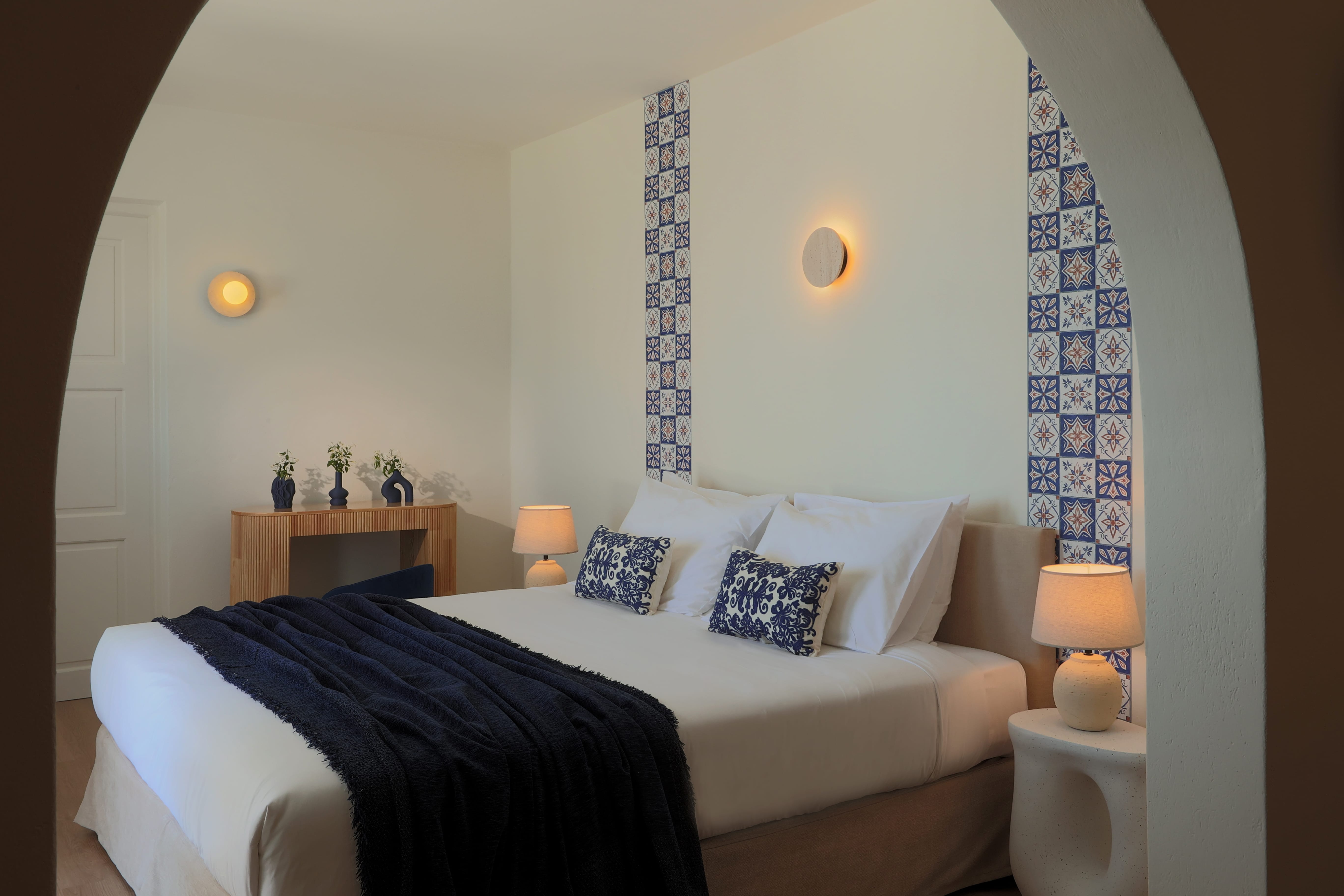 a bed with a blue blanket