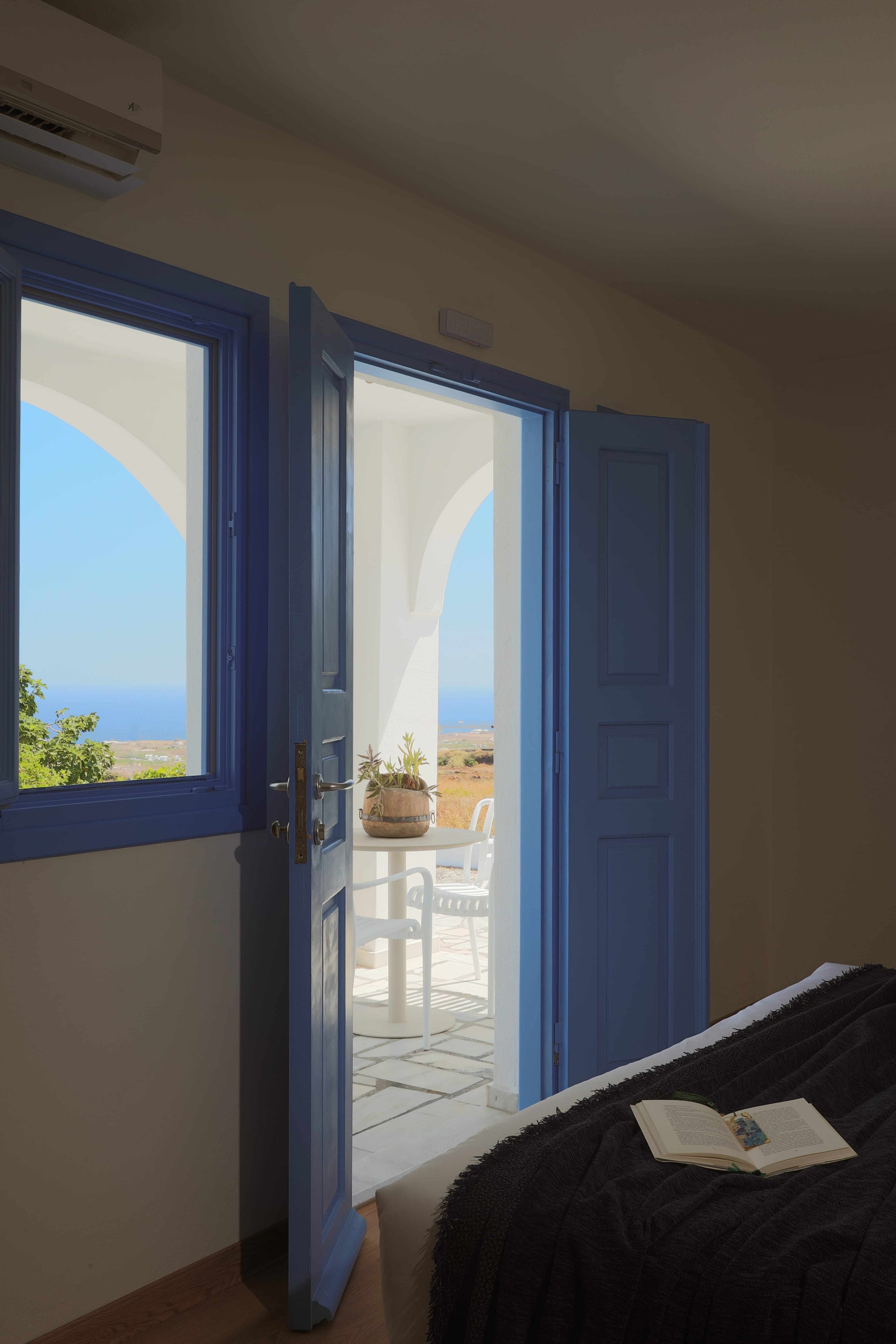 a room with blue doors and a table