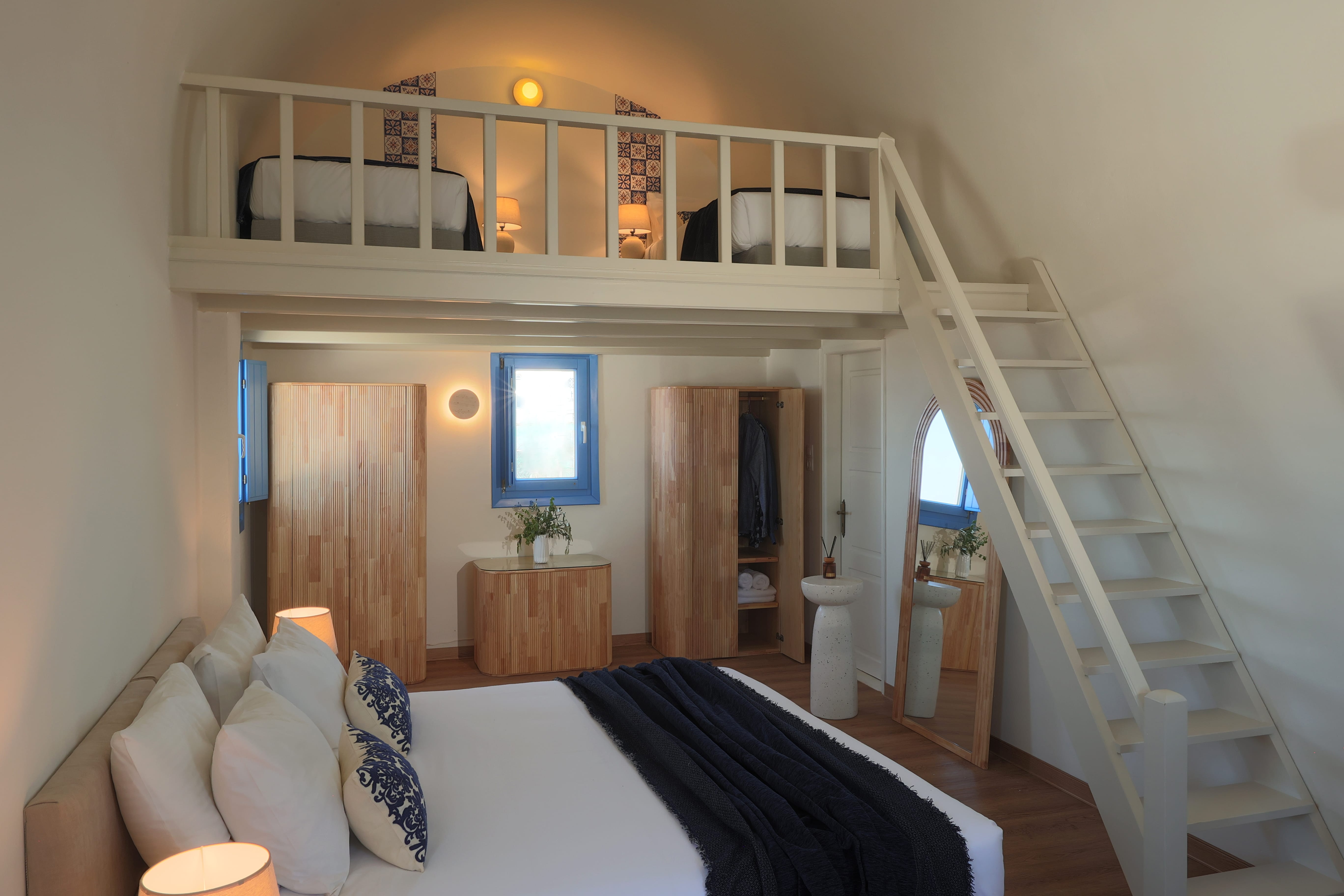a bedroom with a bunk bed and a ladder