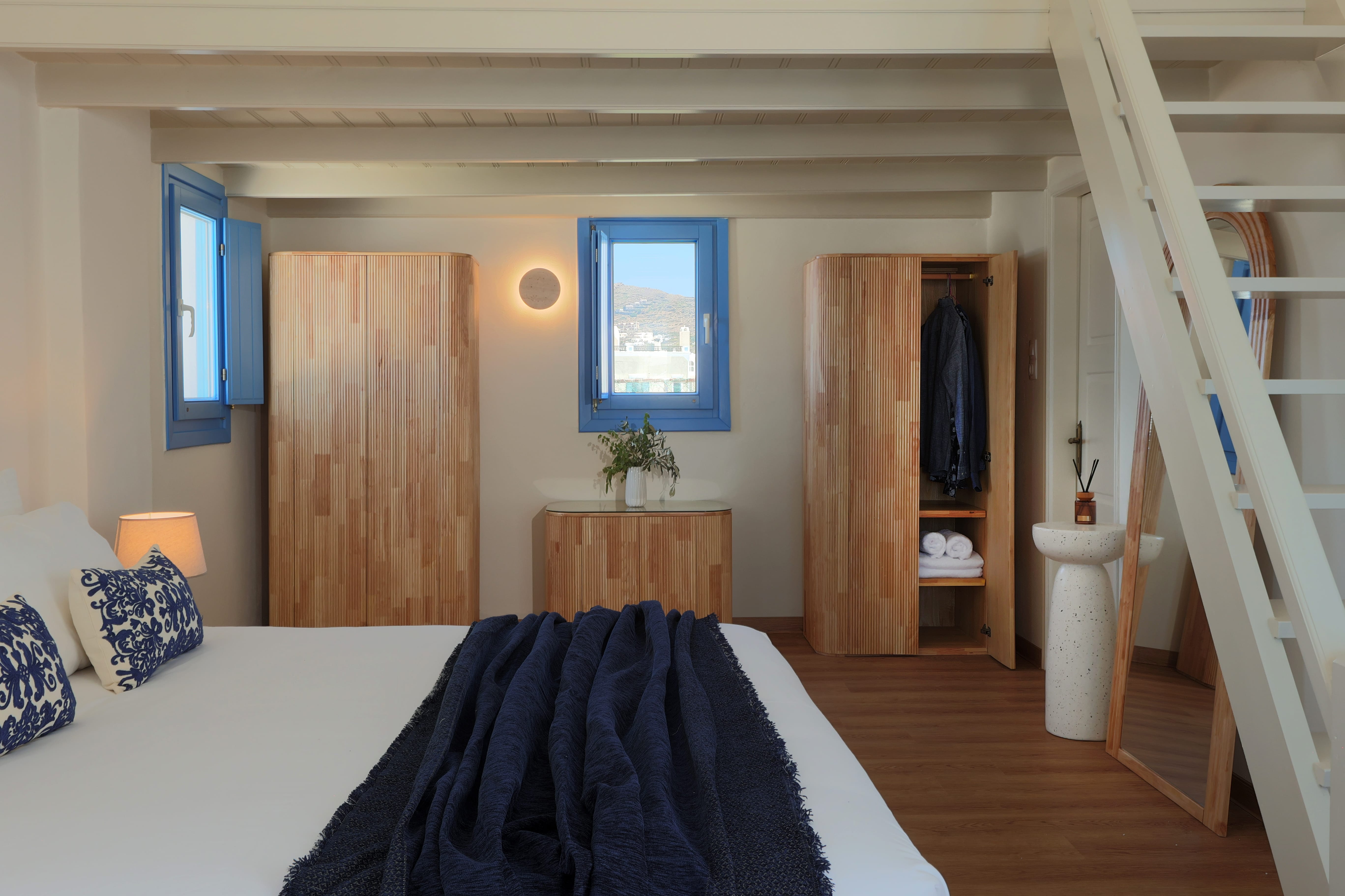 a bedroom with a blue window