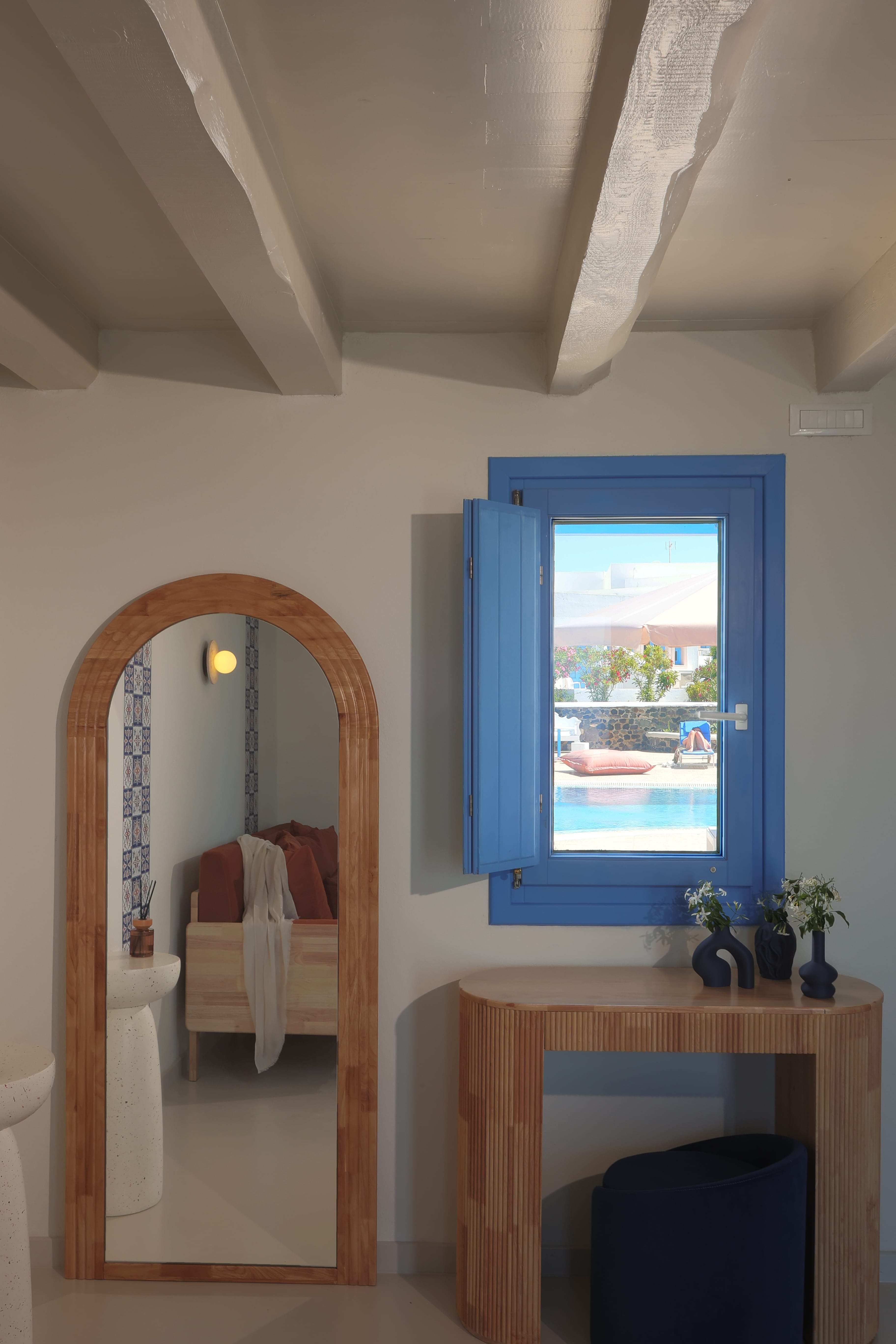 a mirror next to a window