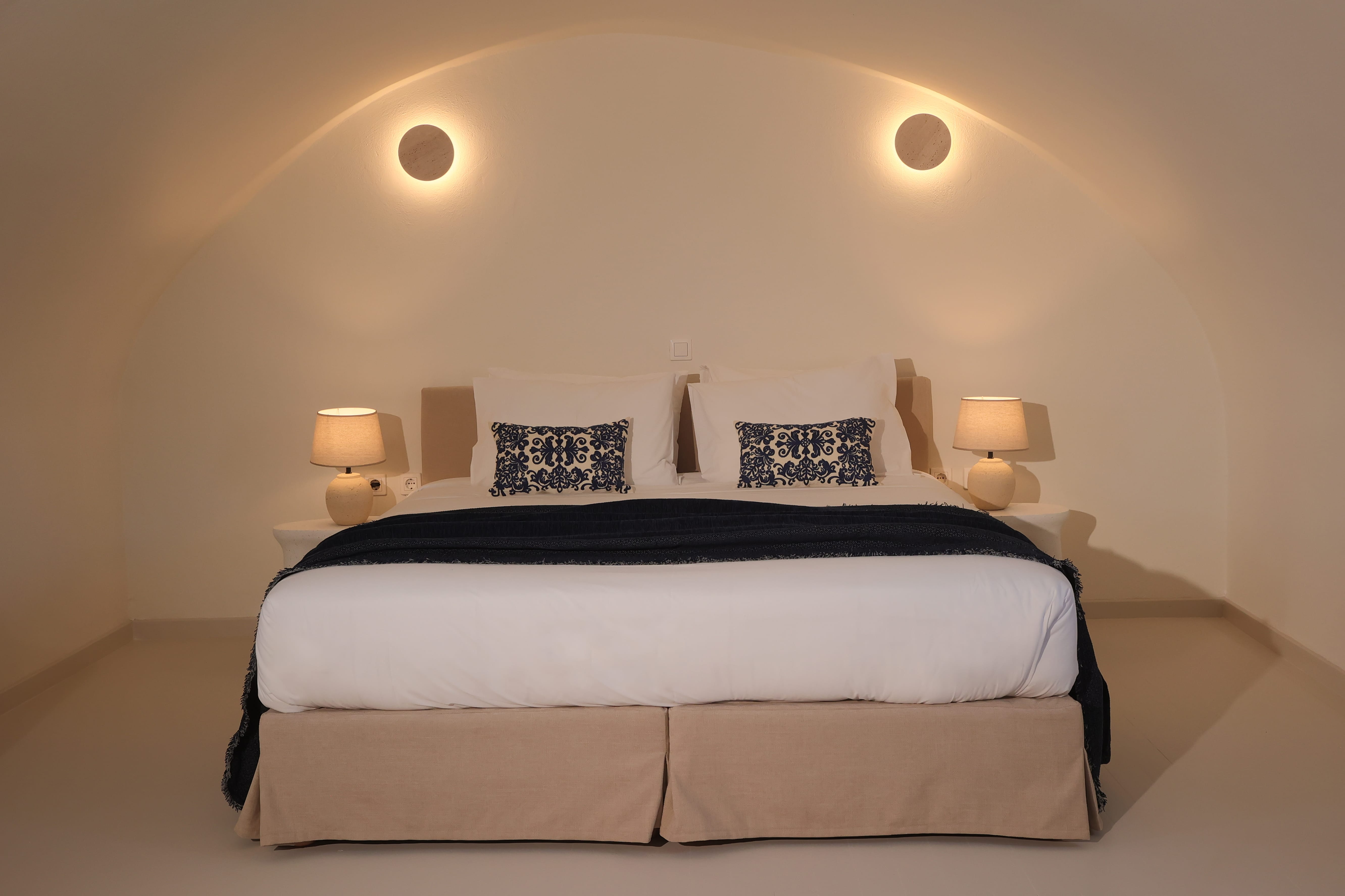 a bed with a black and white bedding
