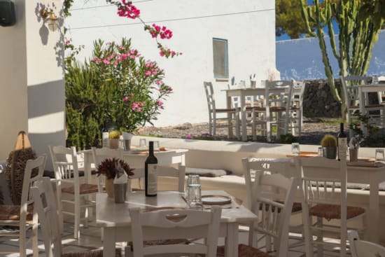 a table and chairs outside a restaurant