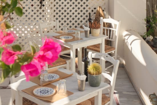 a table and chairs on a patio