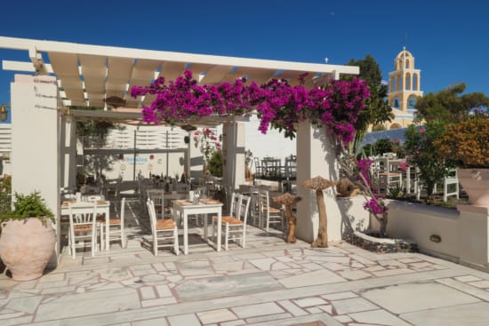 a restaurant with tables and chairs