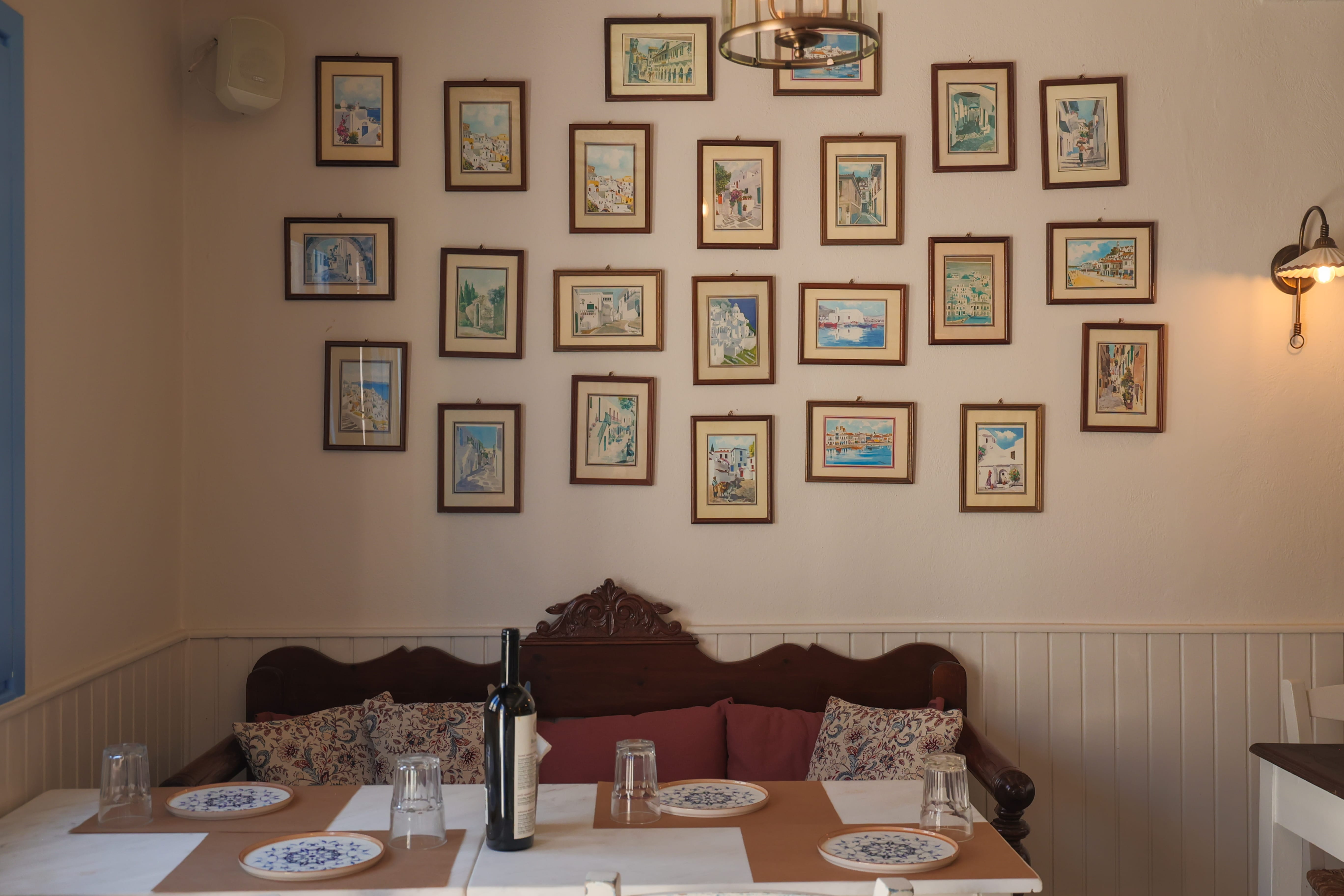 a table with plates and a bottle of wine on it