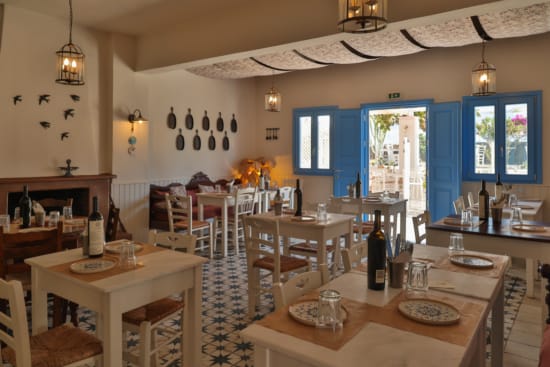 a restaurant with tables and chairs