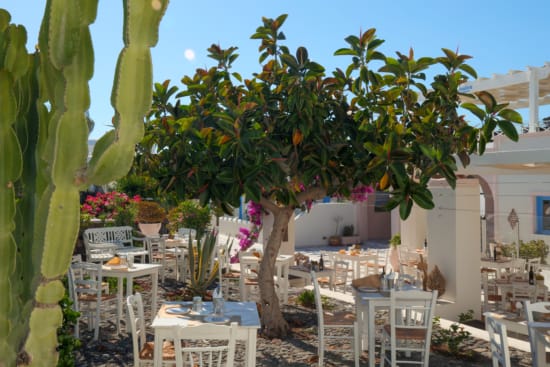 a table and chairs in a courtyard