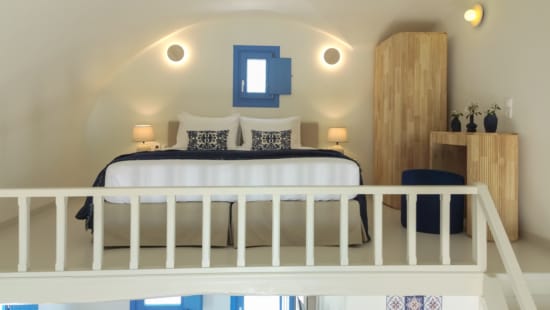a bedroom with a white railing