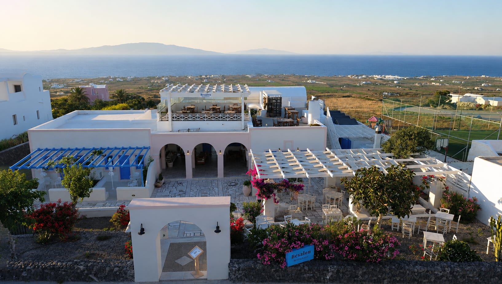 a white building with a large roof