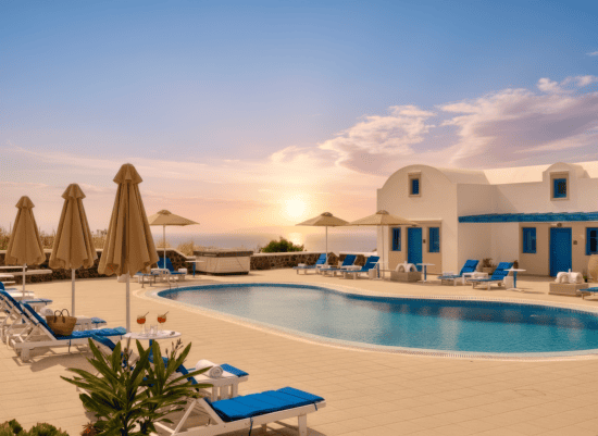 a pool with chairs and umbrellas by a building