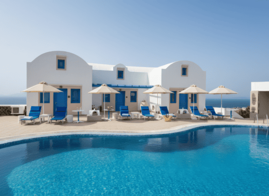 a pool with chairs and umbrellas by a building