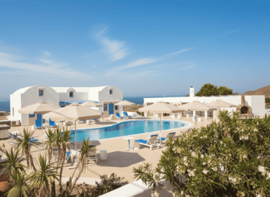 a pool with umbrellas and chairs