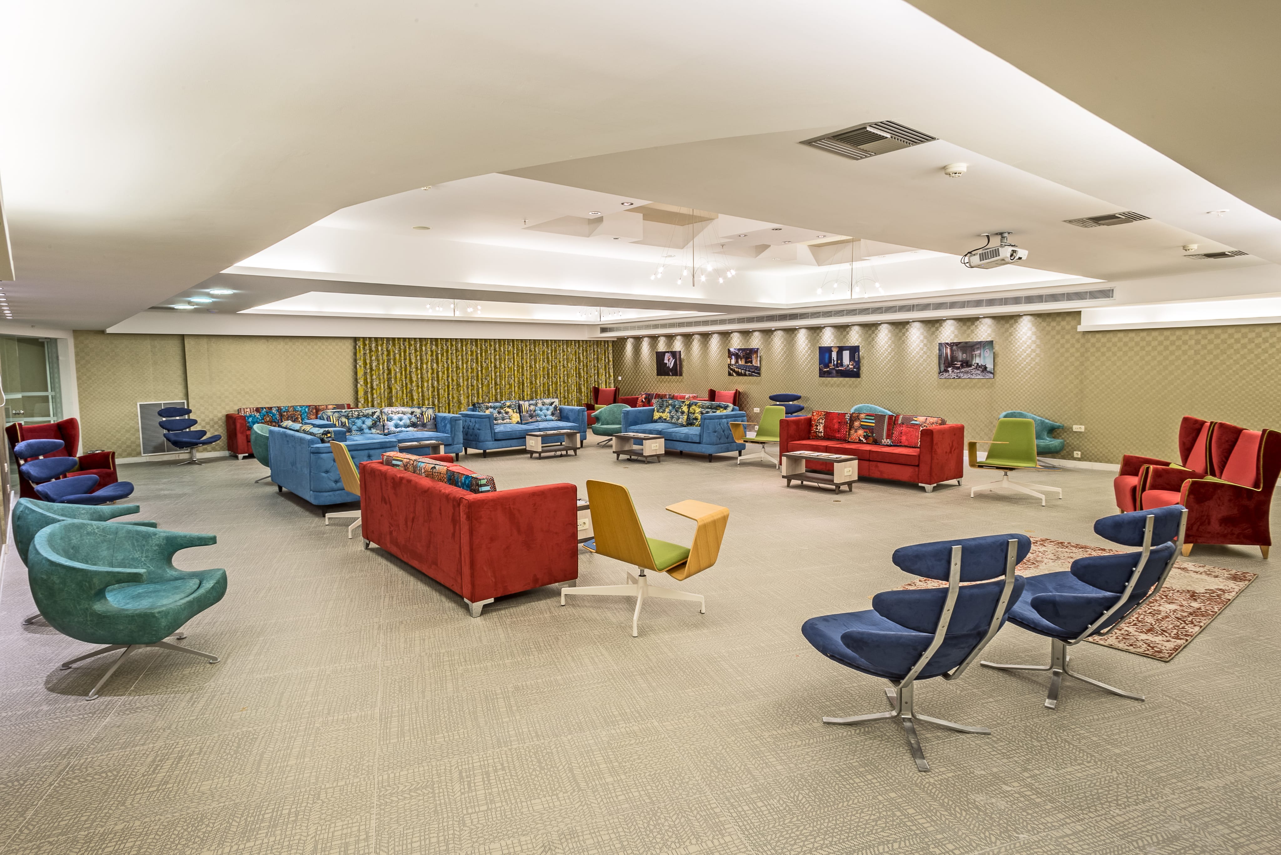 a room with persony chairs and tables