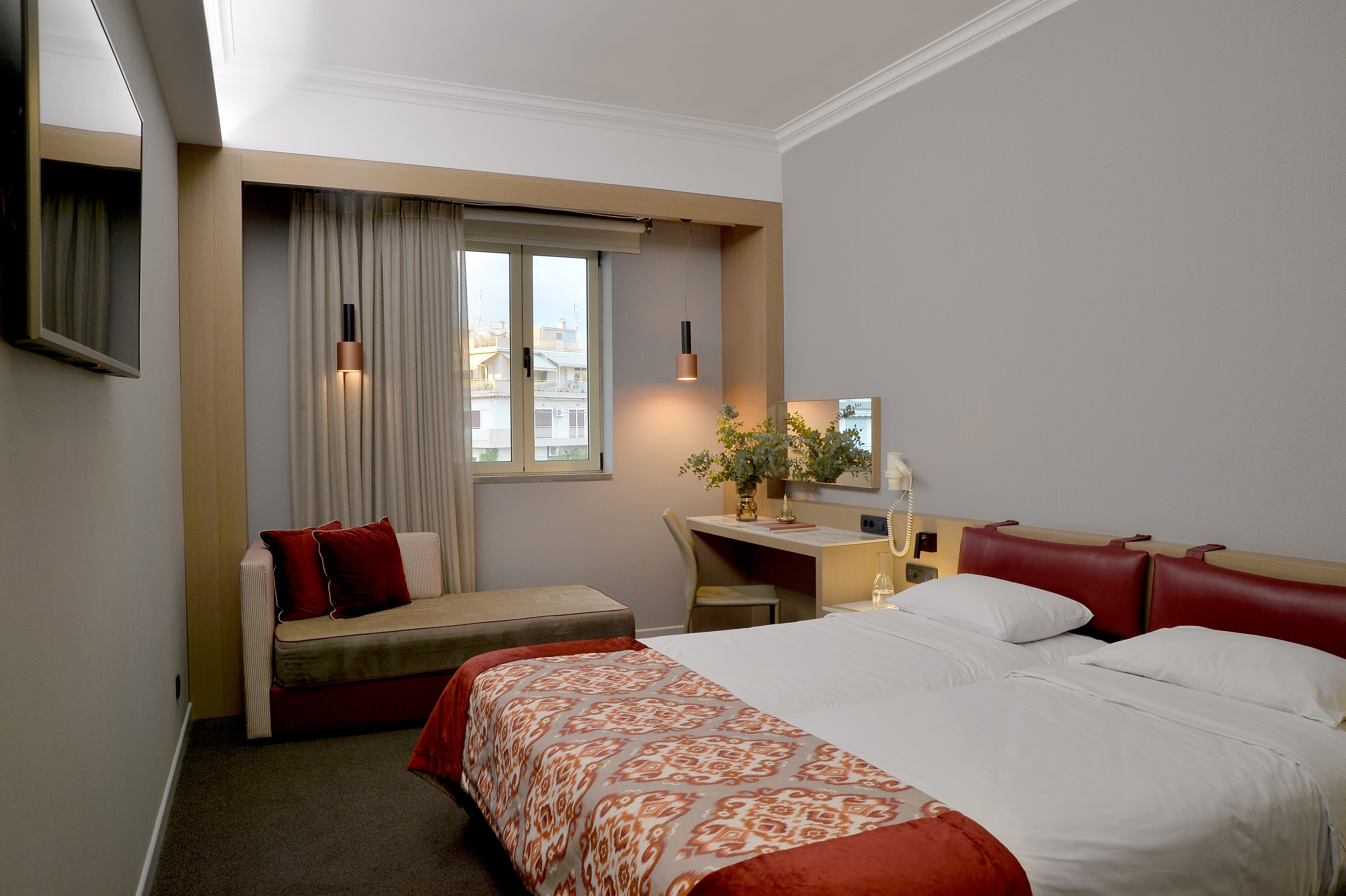 a bedroom with a bed and a chair