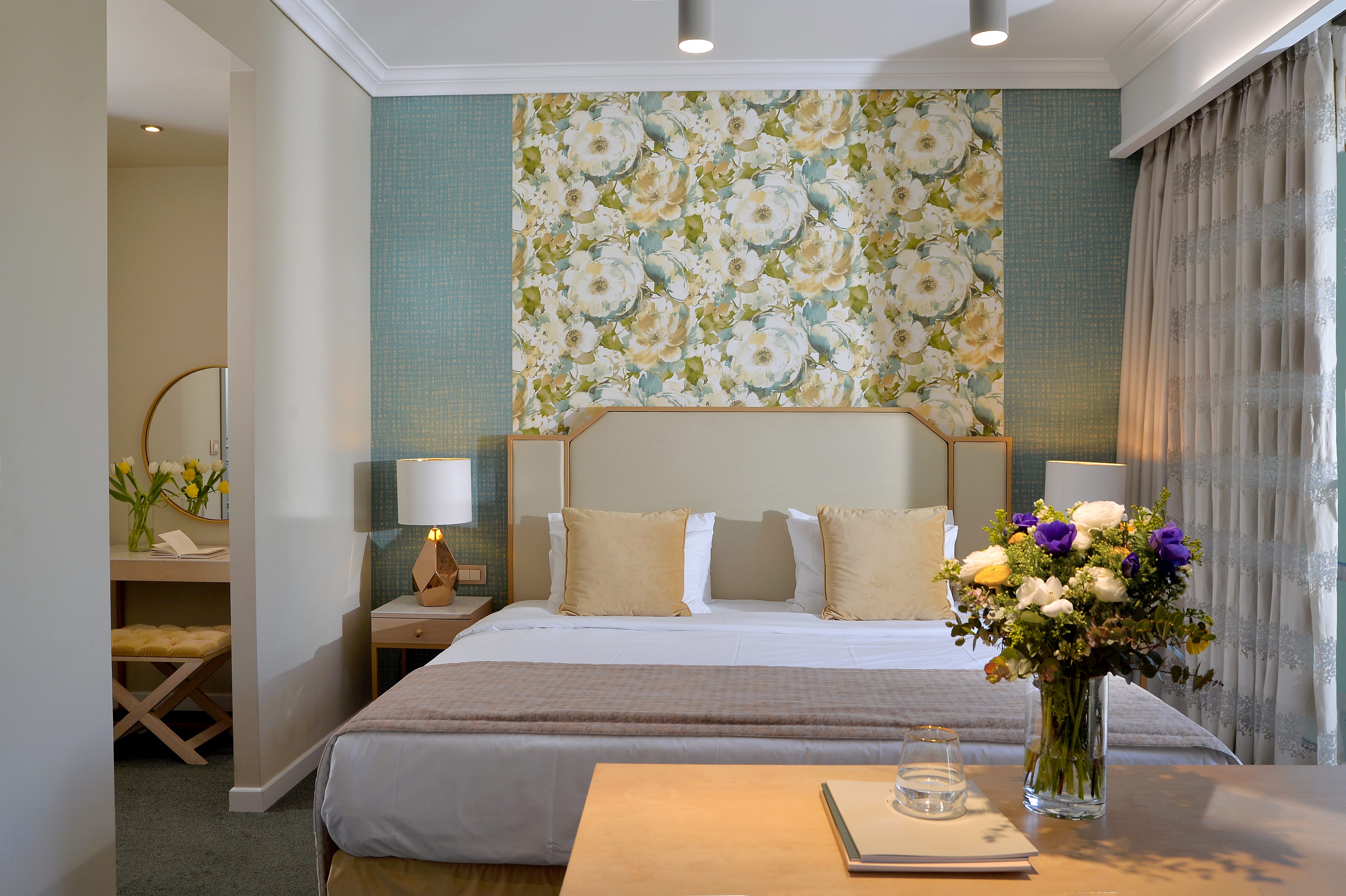 a room with a bed and flowers