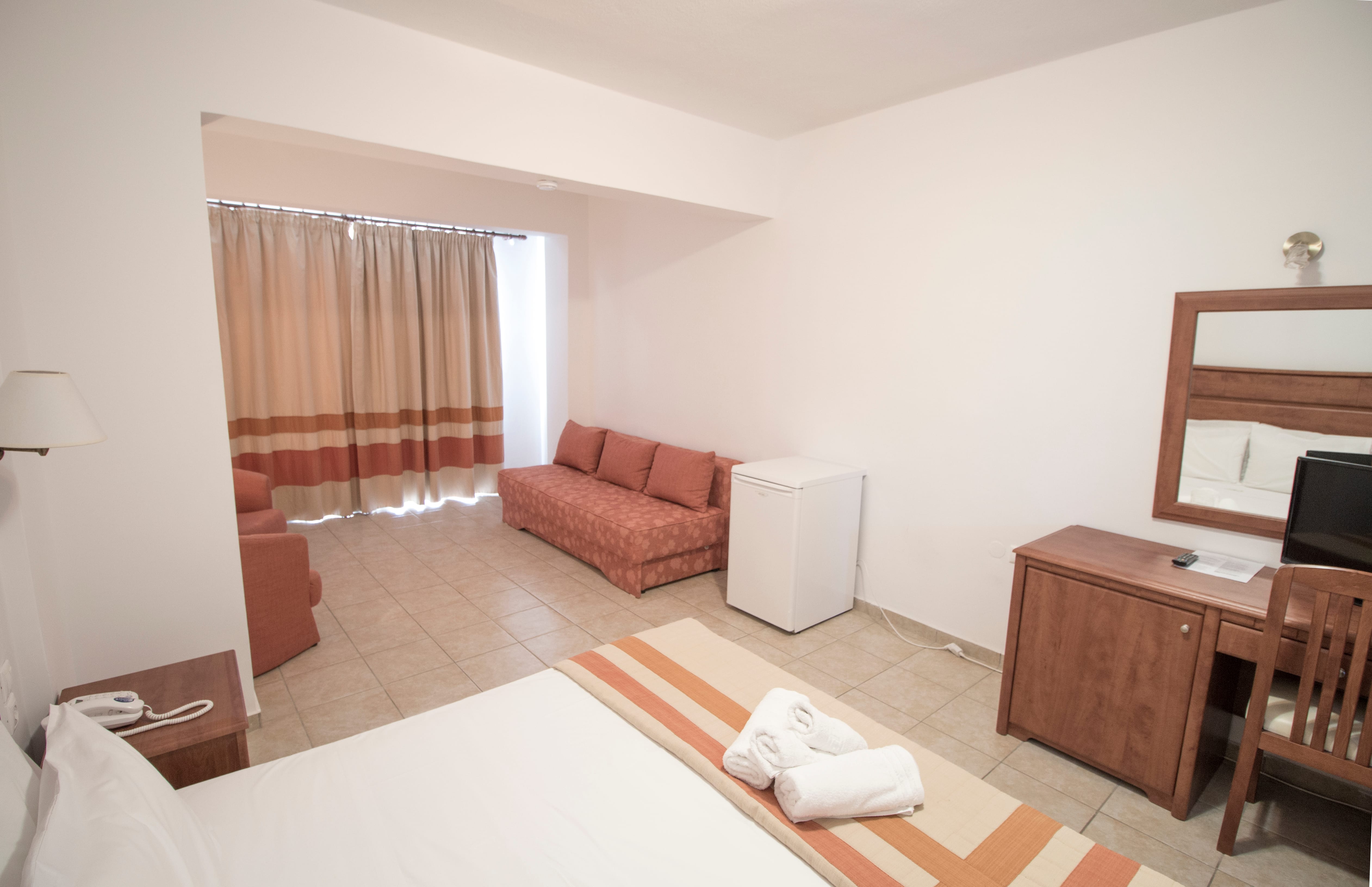 a room with a bed and a couch