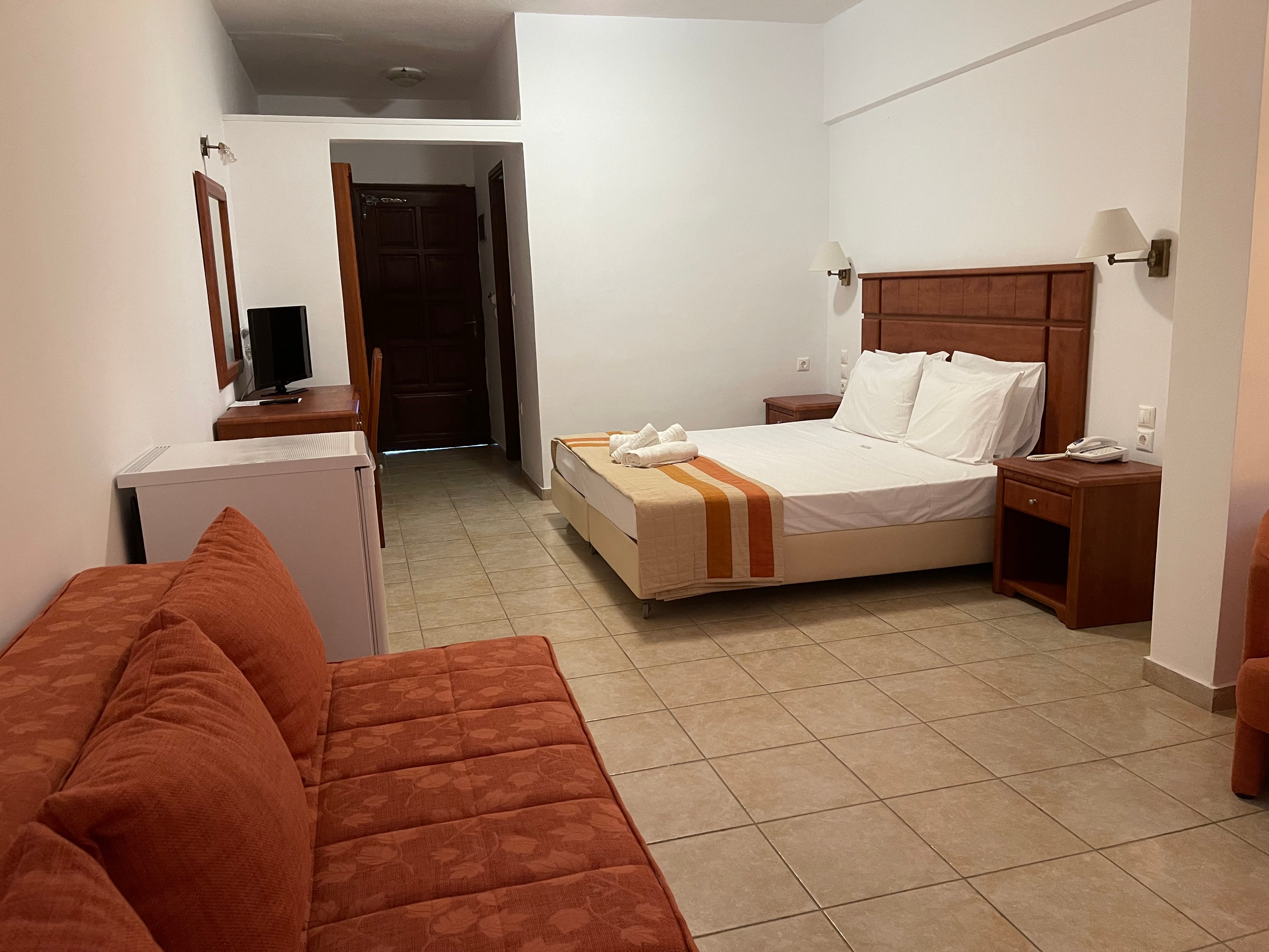 a room with a bed and a couch