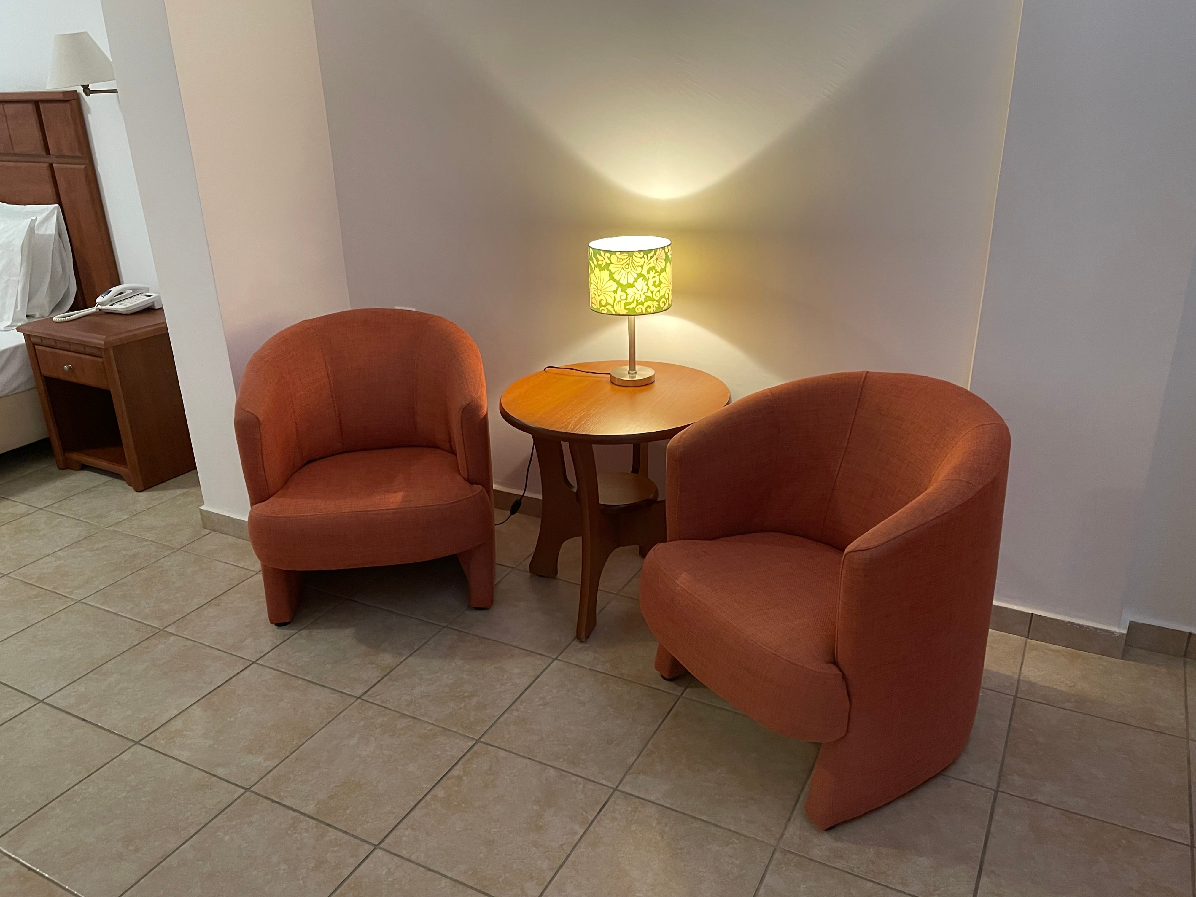 two chairs next to a table