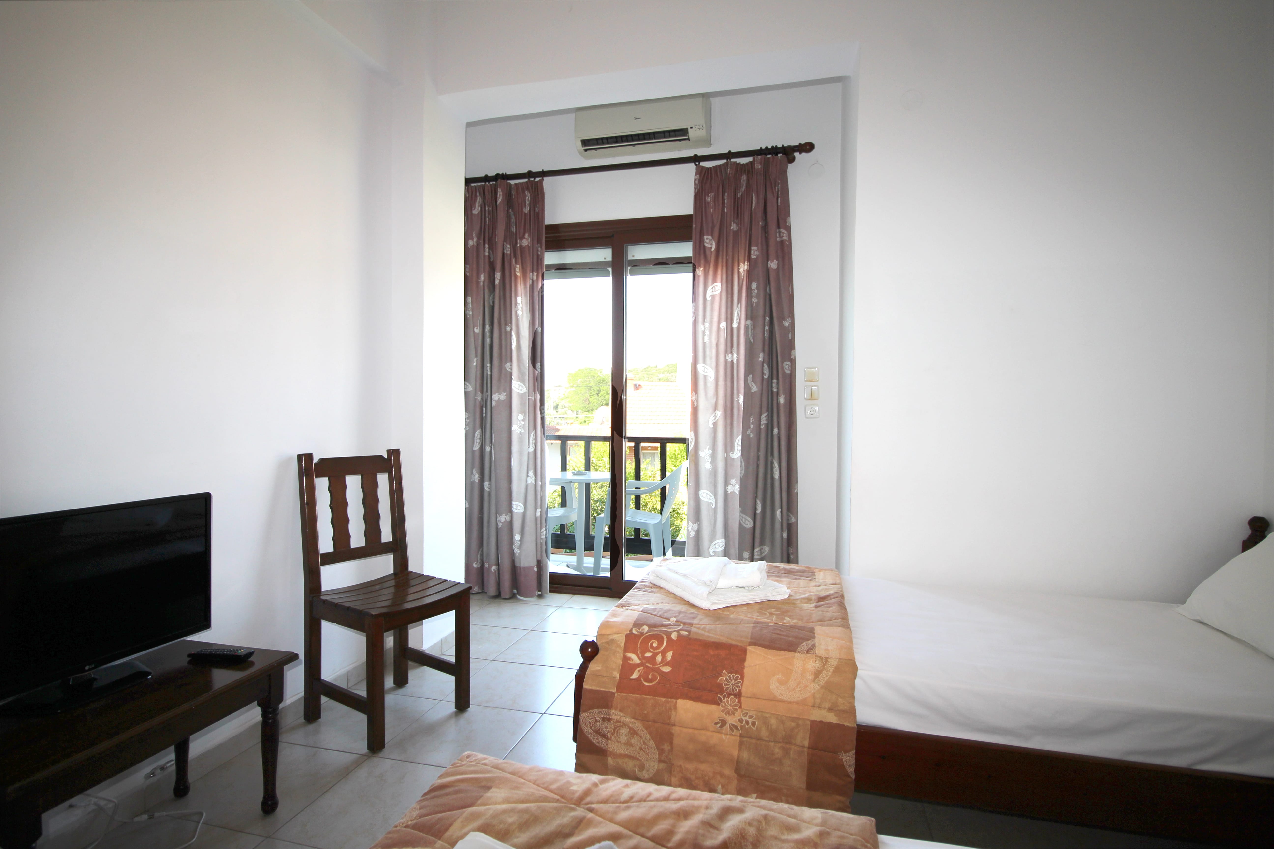 a bedroom with a bed and a chair
