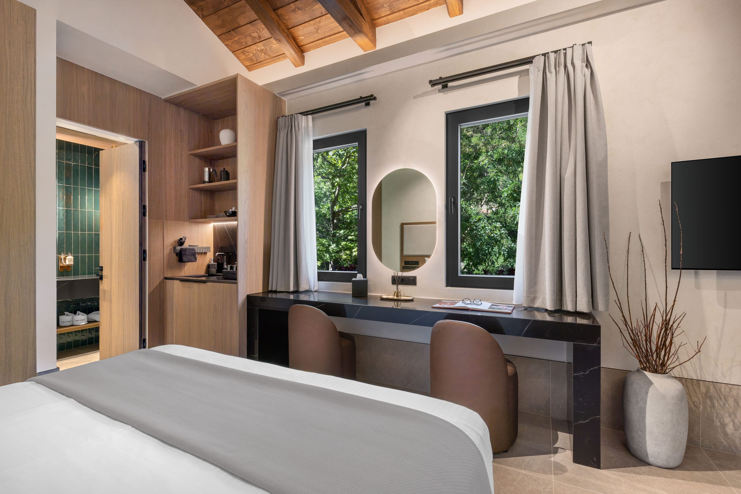 a room with a bed and a mirror
