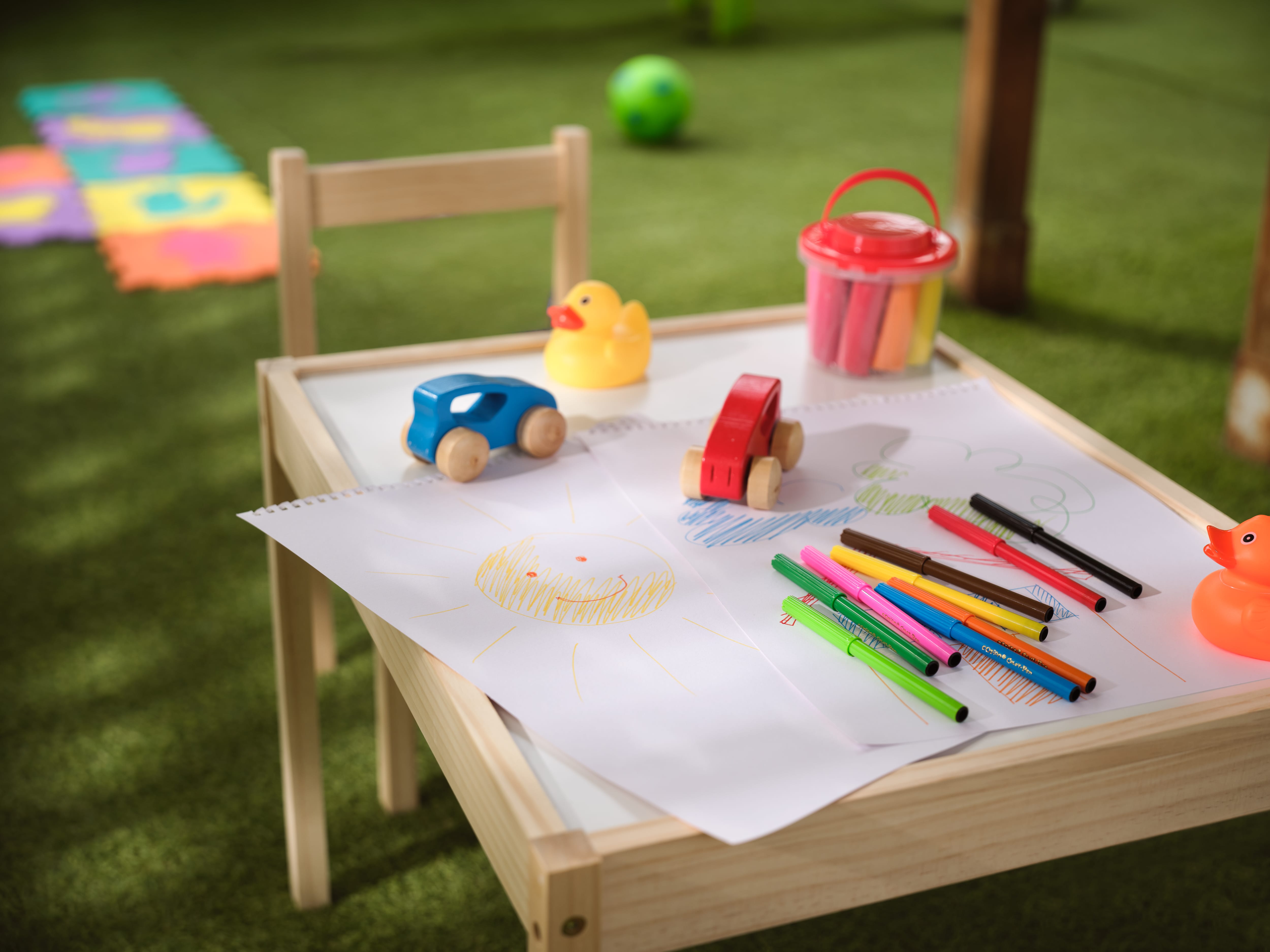 a table with toys and markers on it