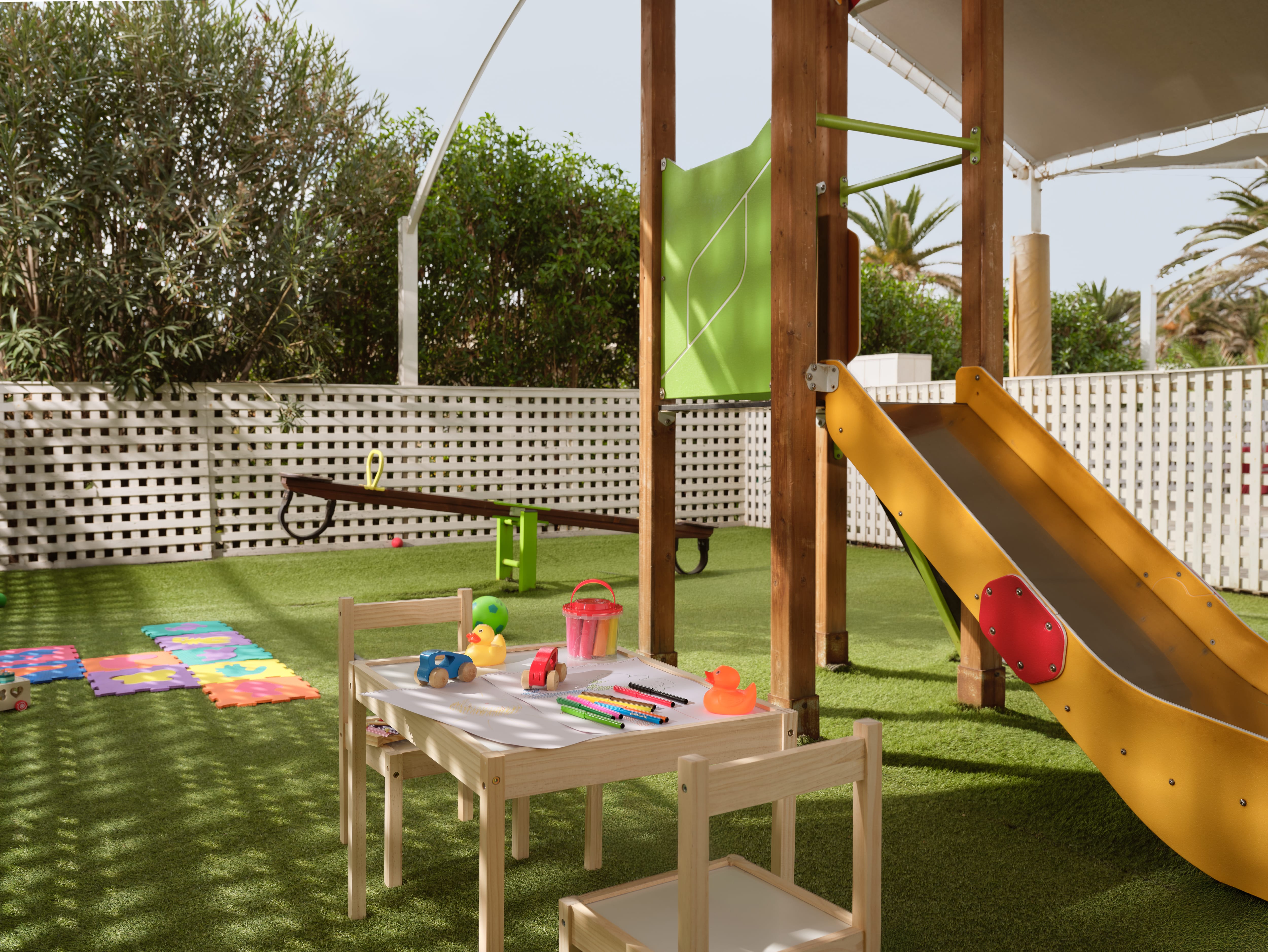 a playground with a slide and toys