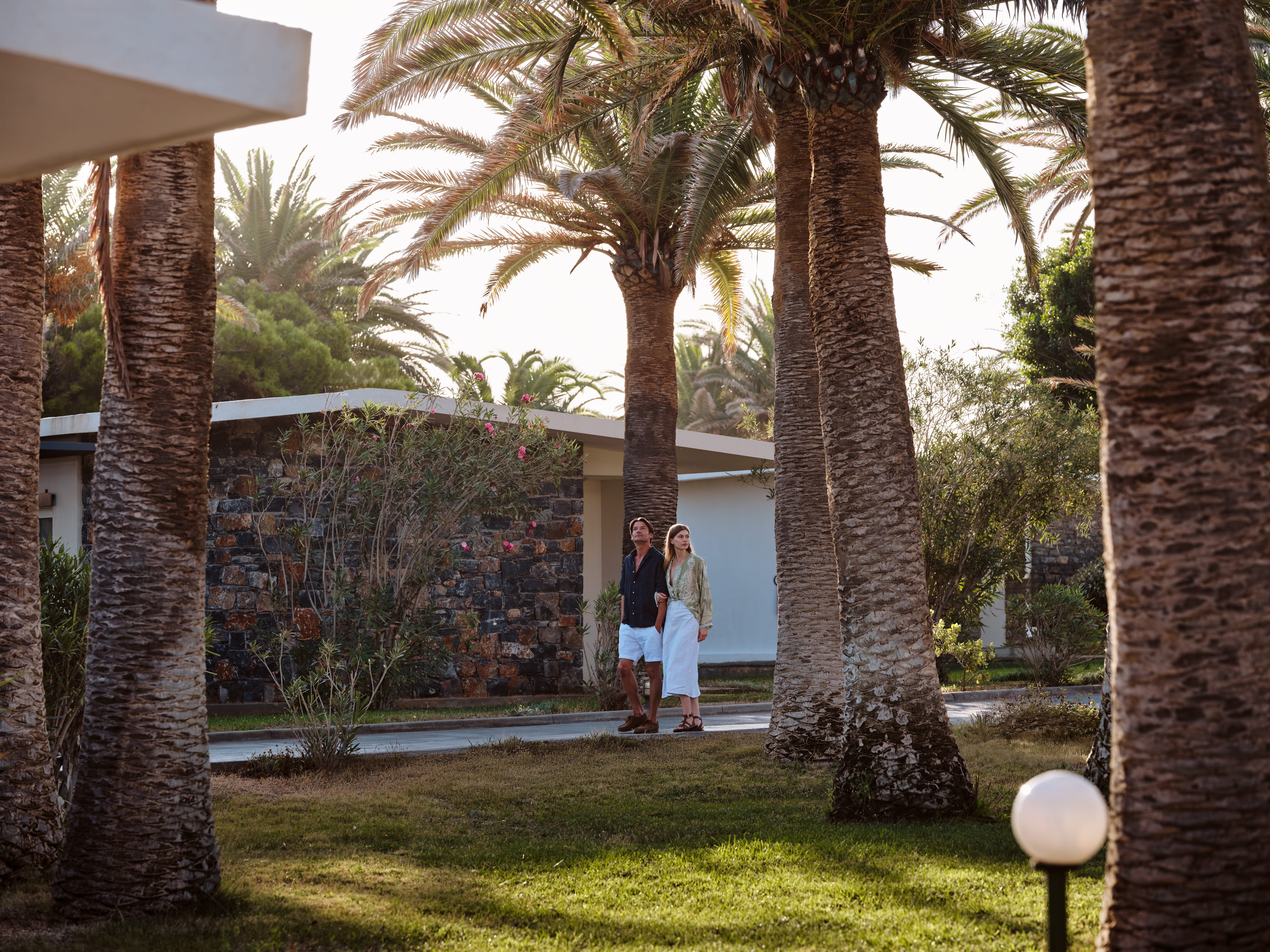 a couple standing in a yard