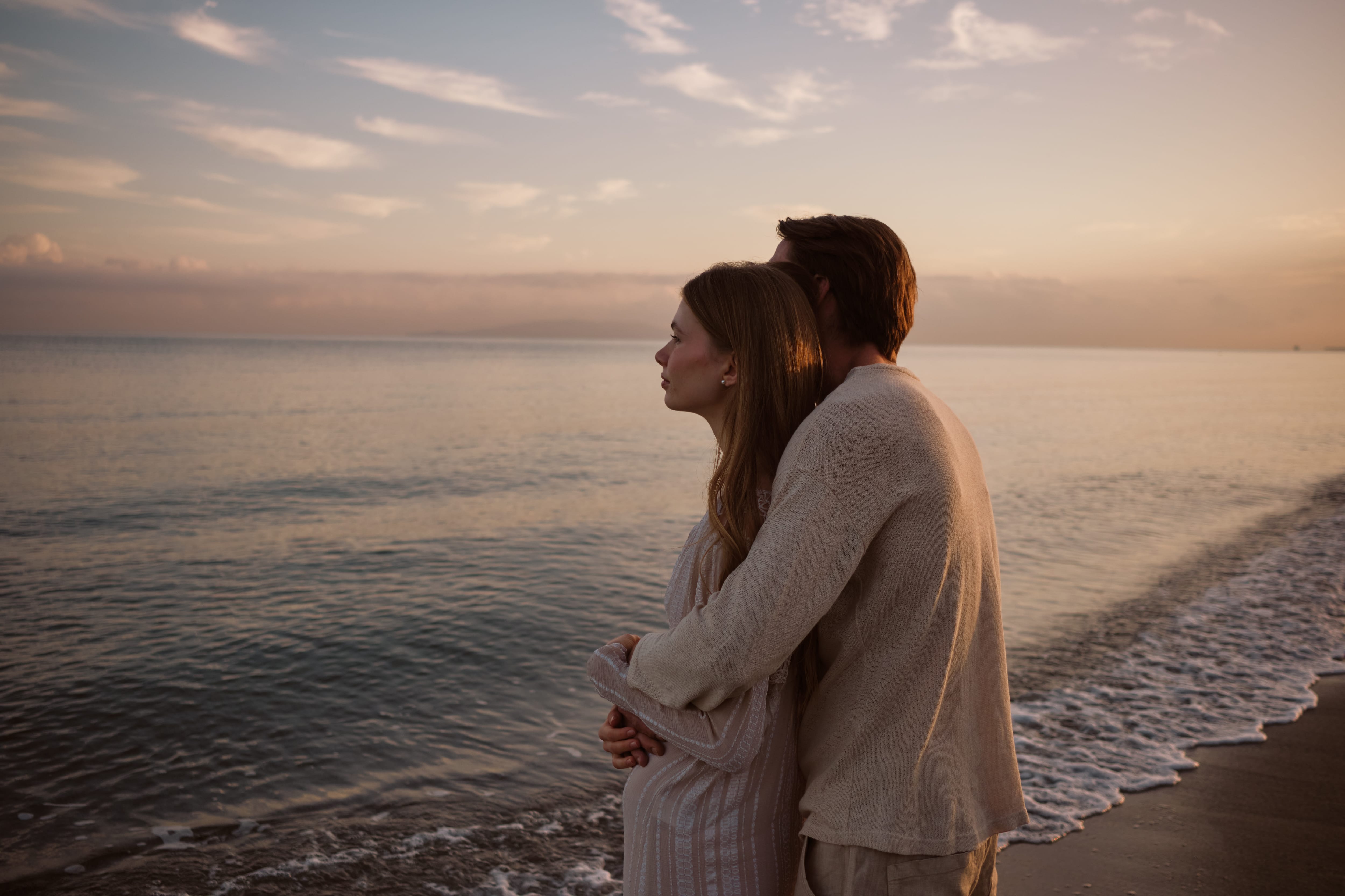 a person and person standing on a beach