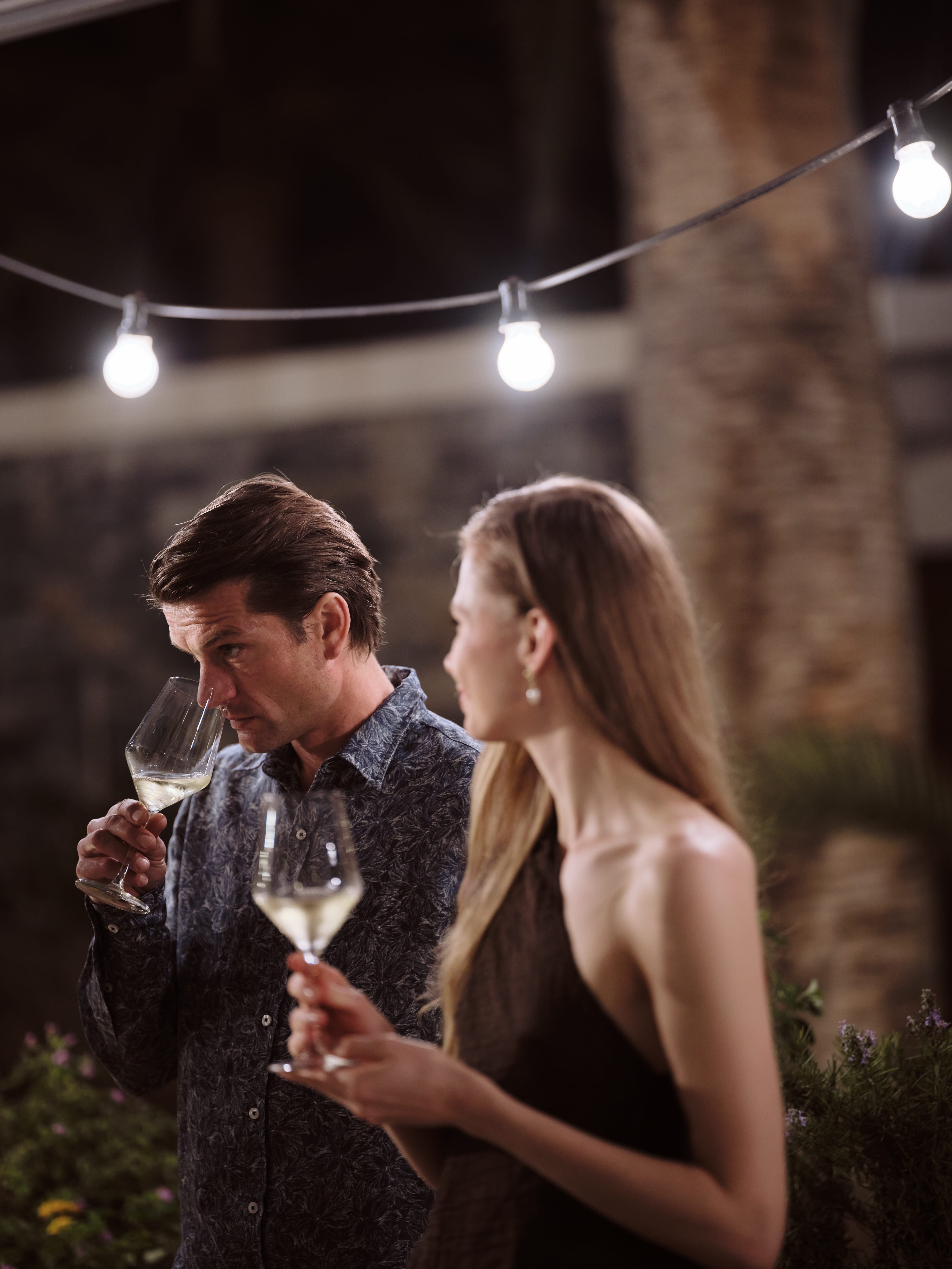 a person and person drinking wine