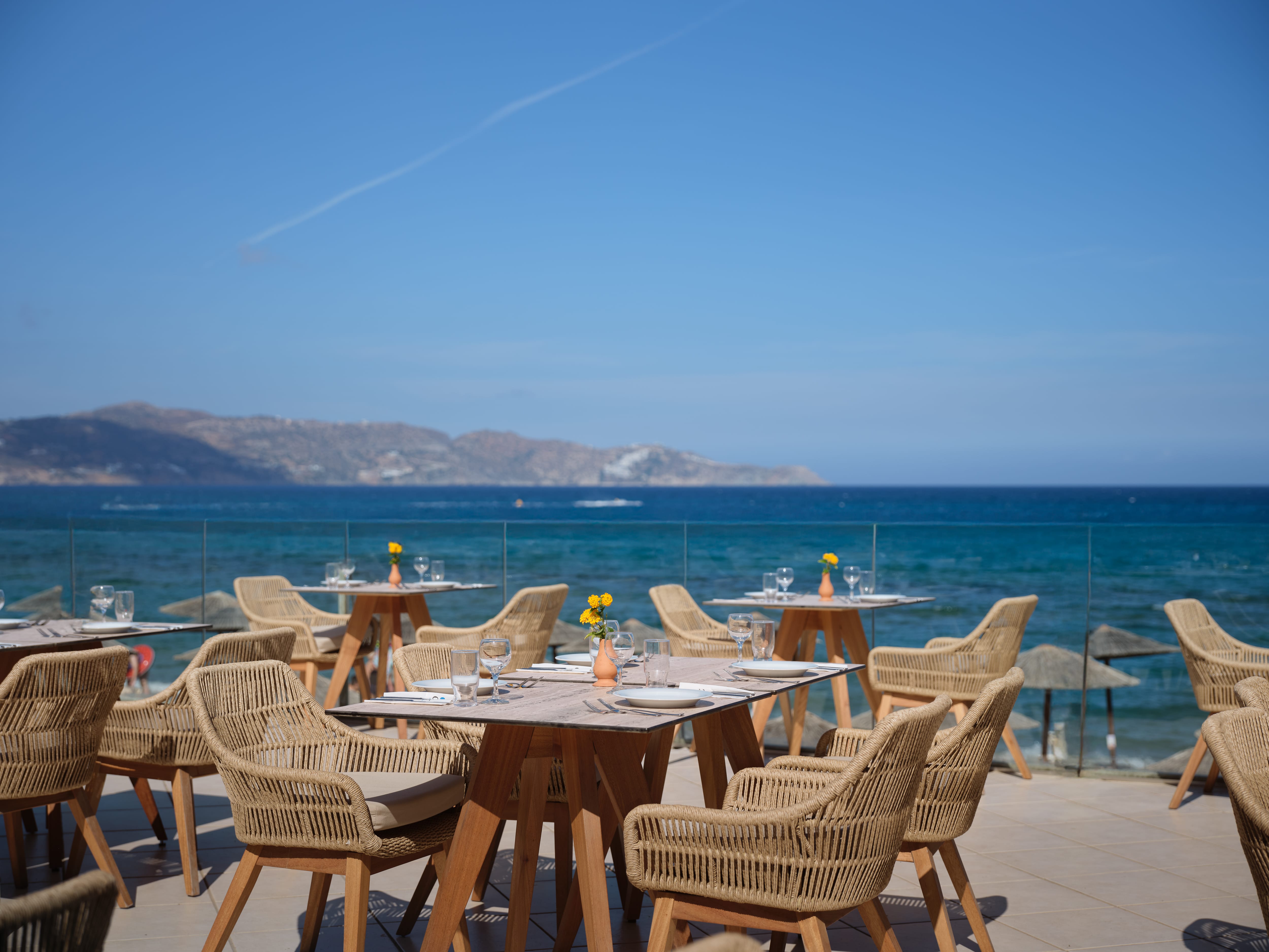 a table and chairs on a beach