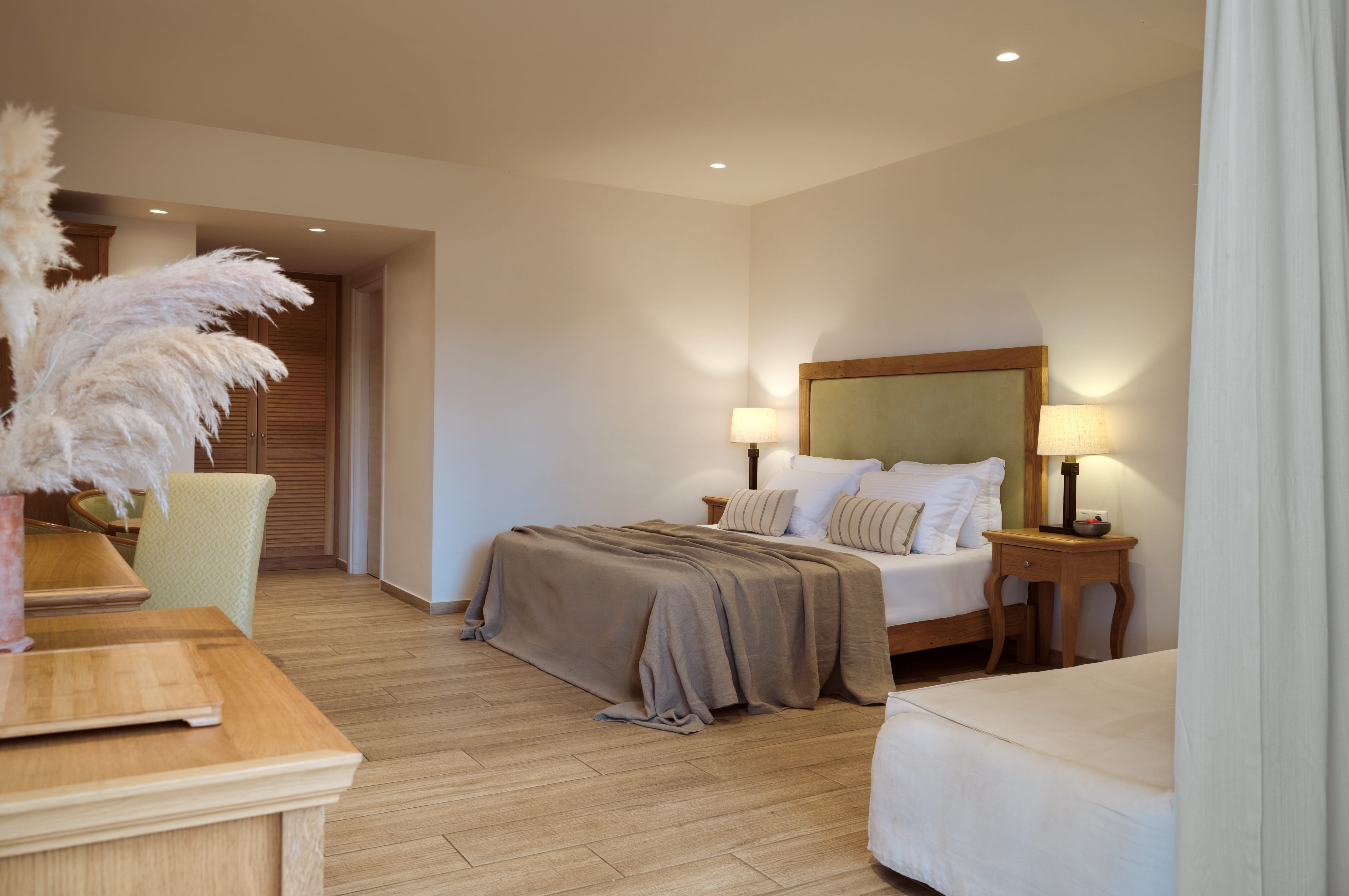 a bedroom with a bed and a table