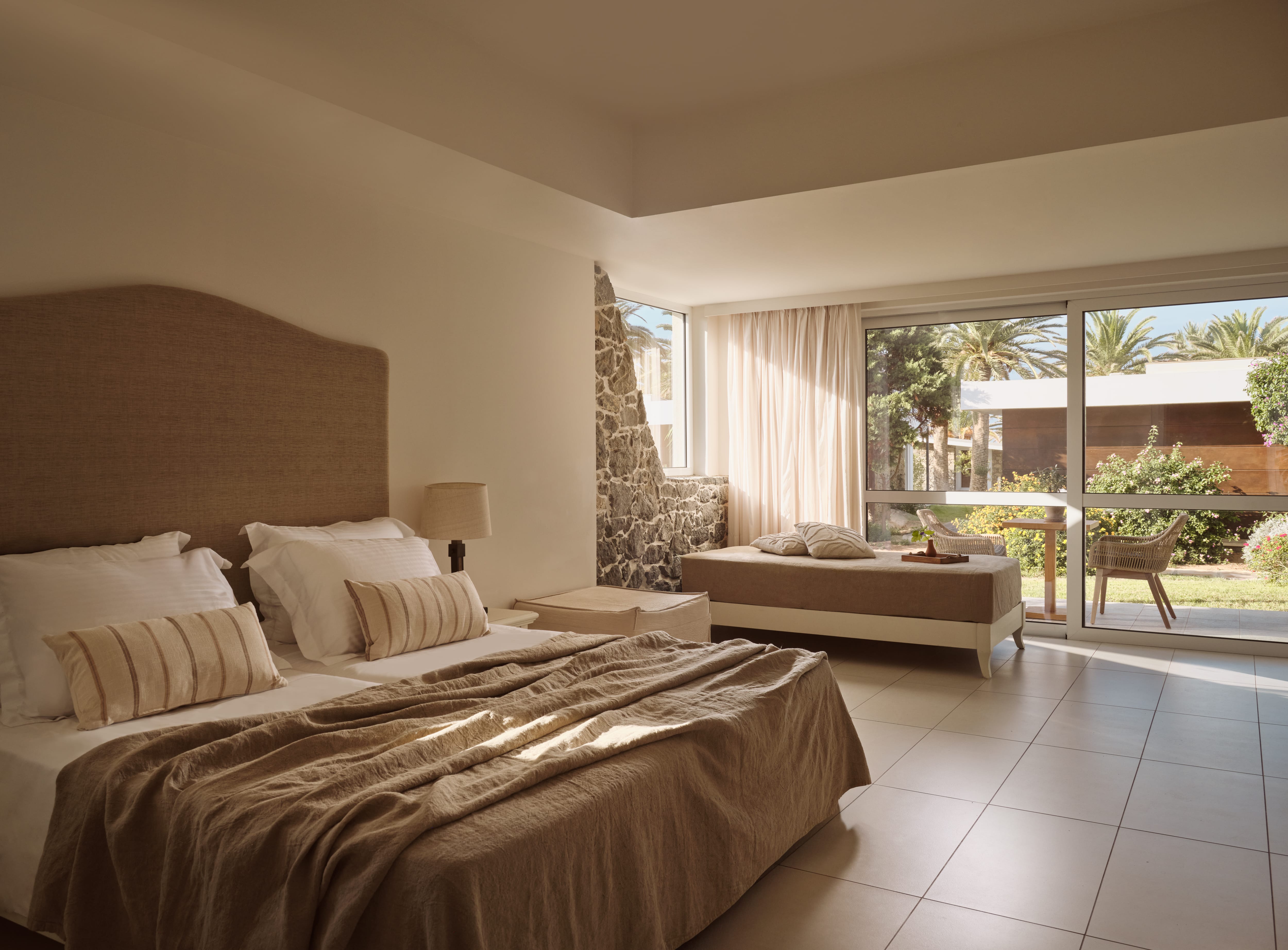 a bedroom with a bed and a sliding glass door
