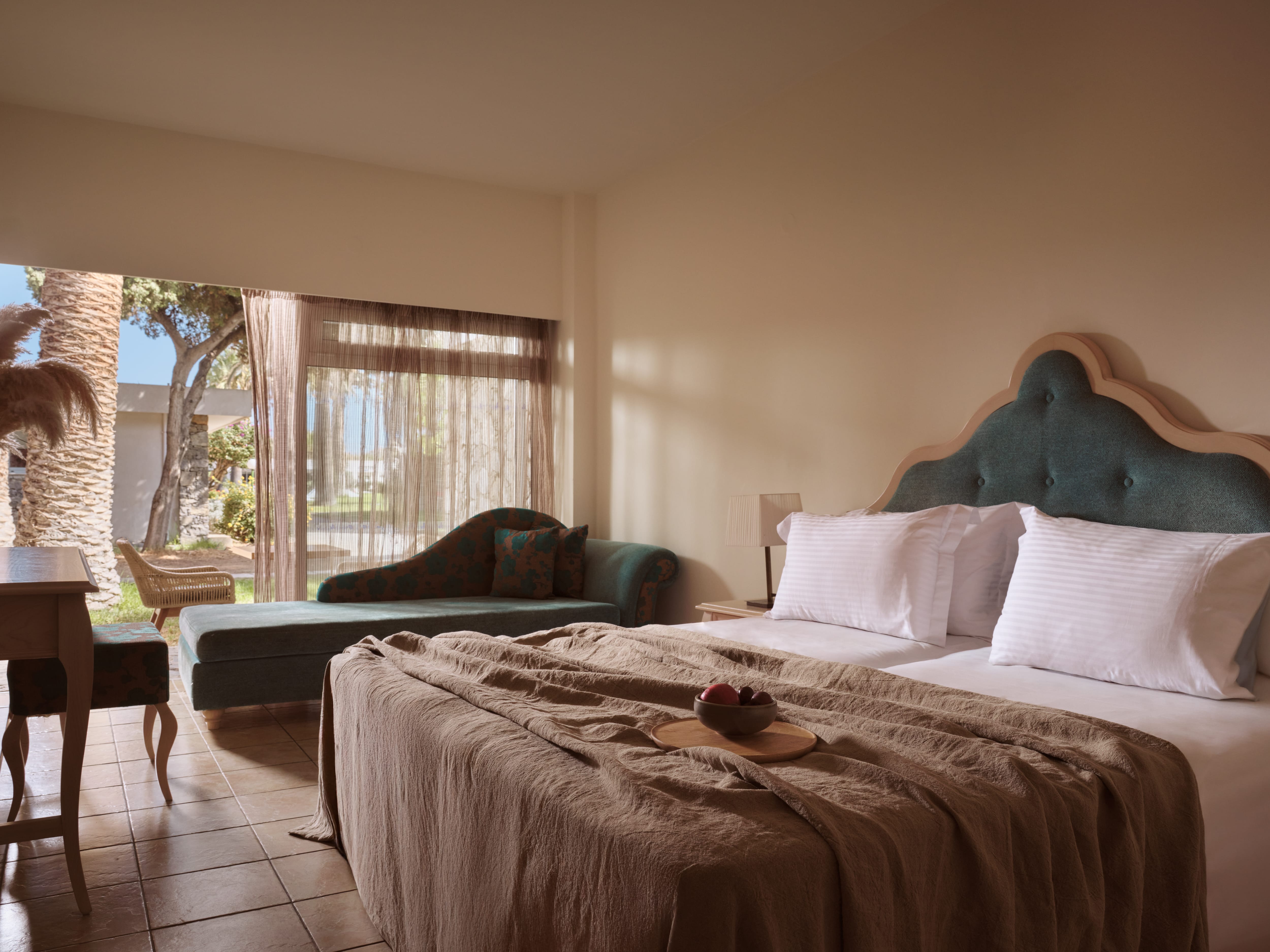 a bedroom with a bed and a chair