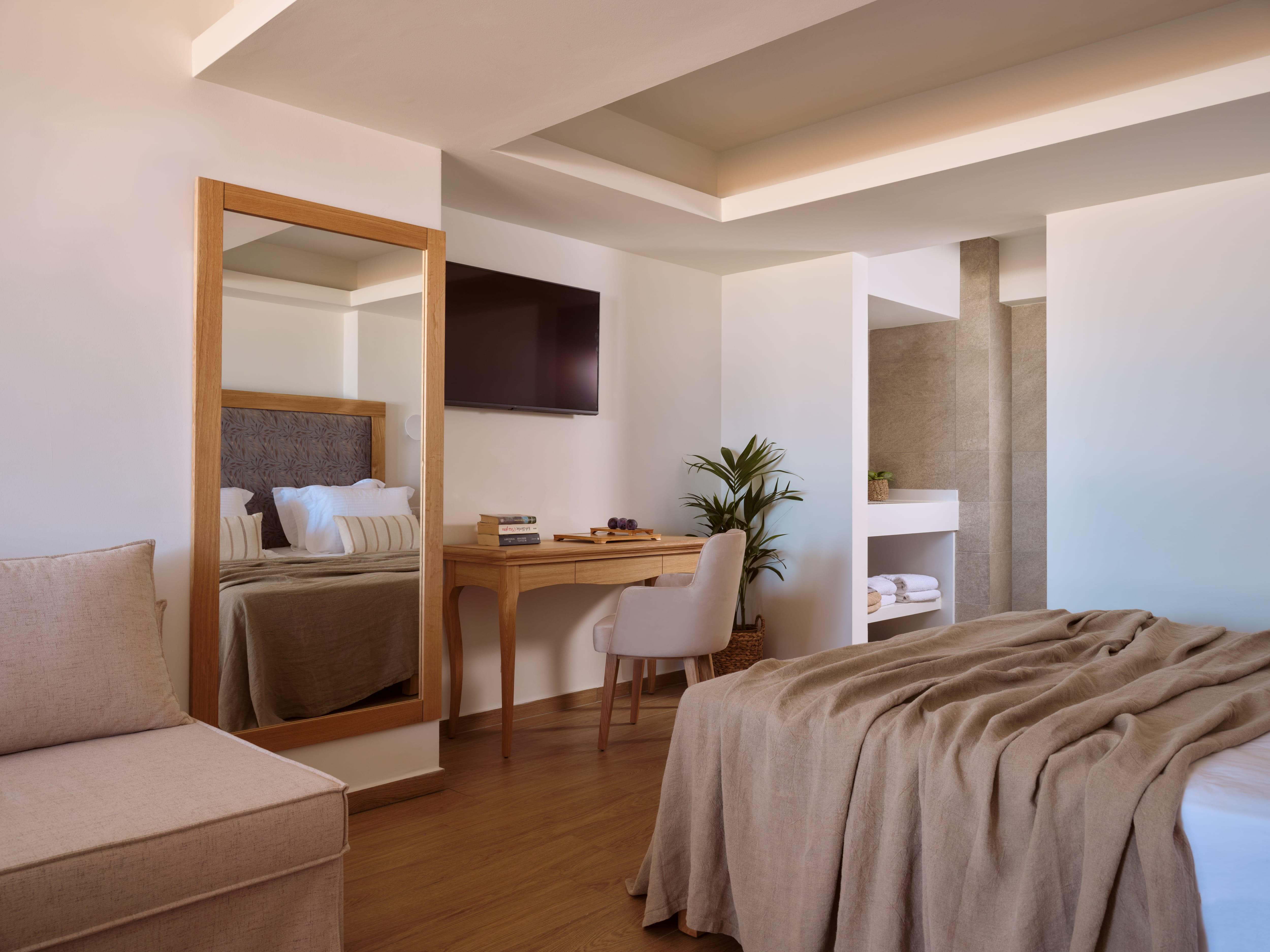 a bedroom with a bed and a desk