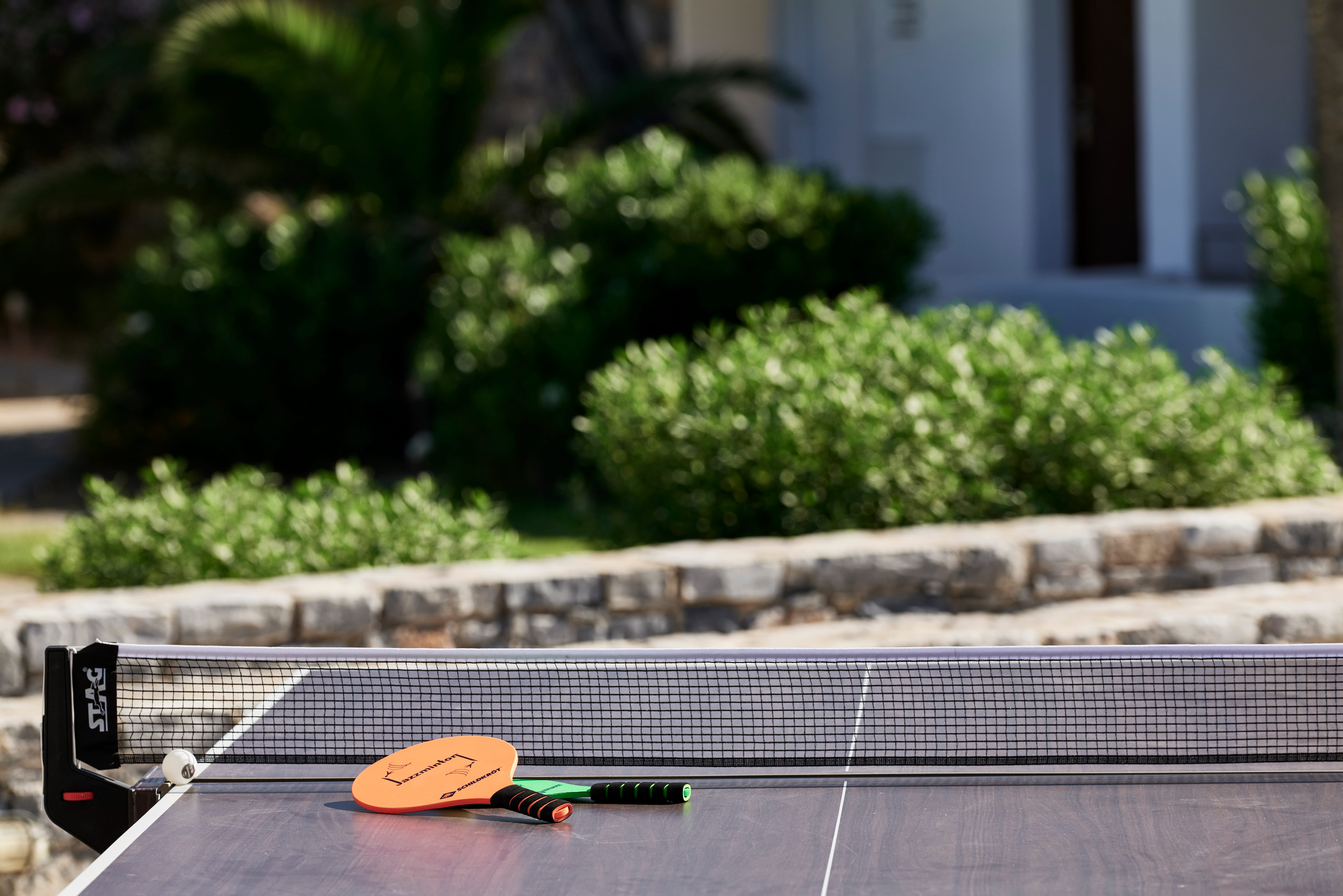 a racket and paddle on a table