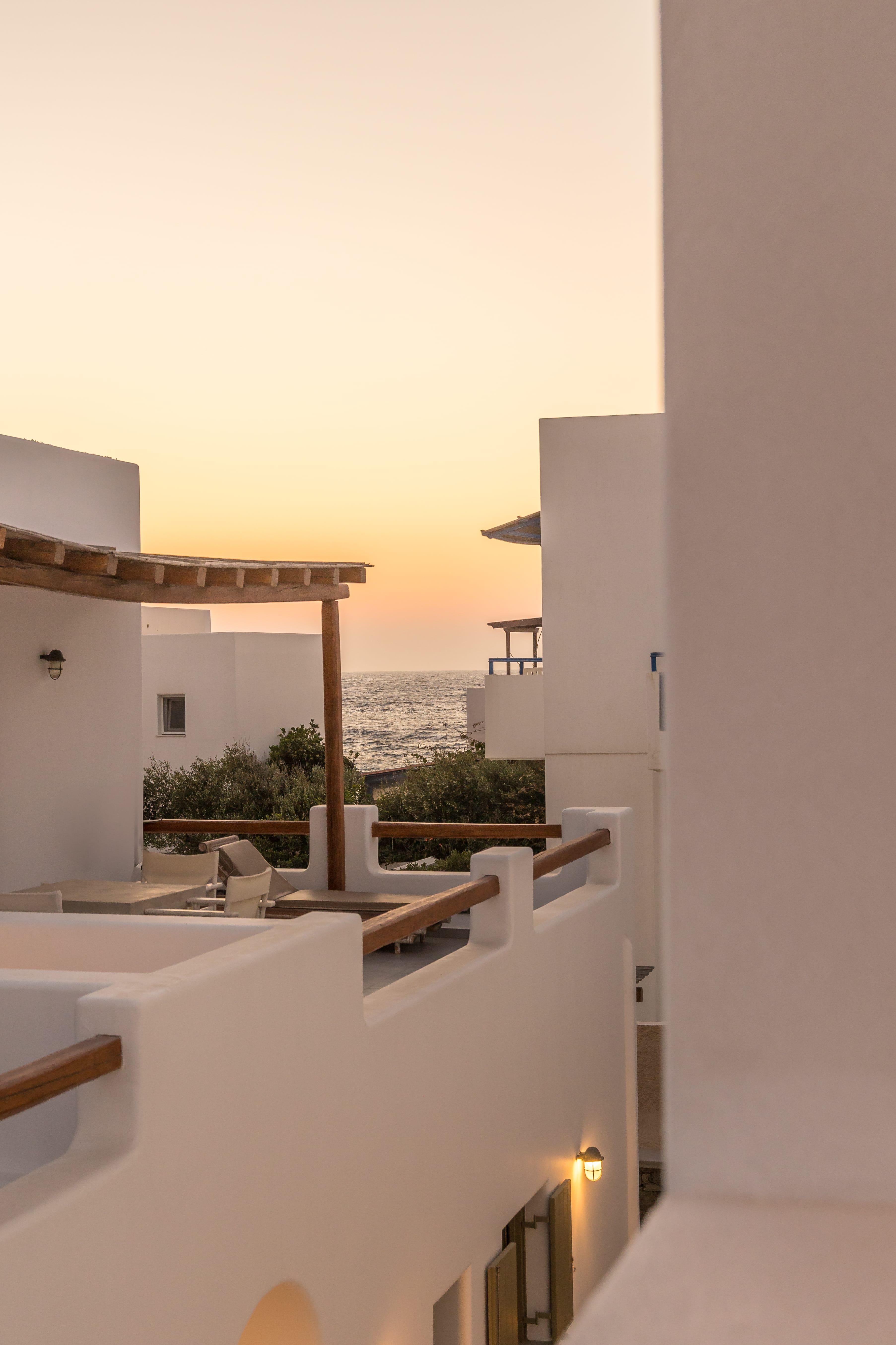 a white building with a wooden roof