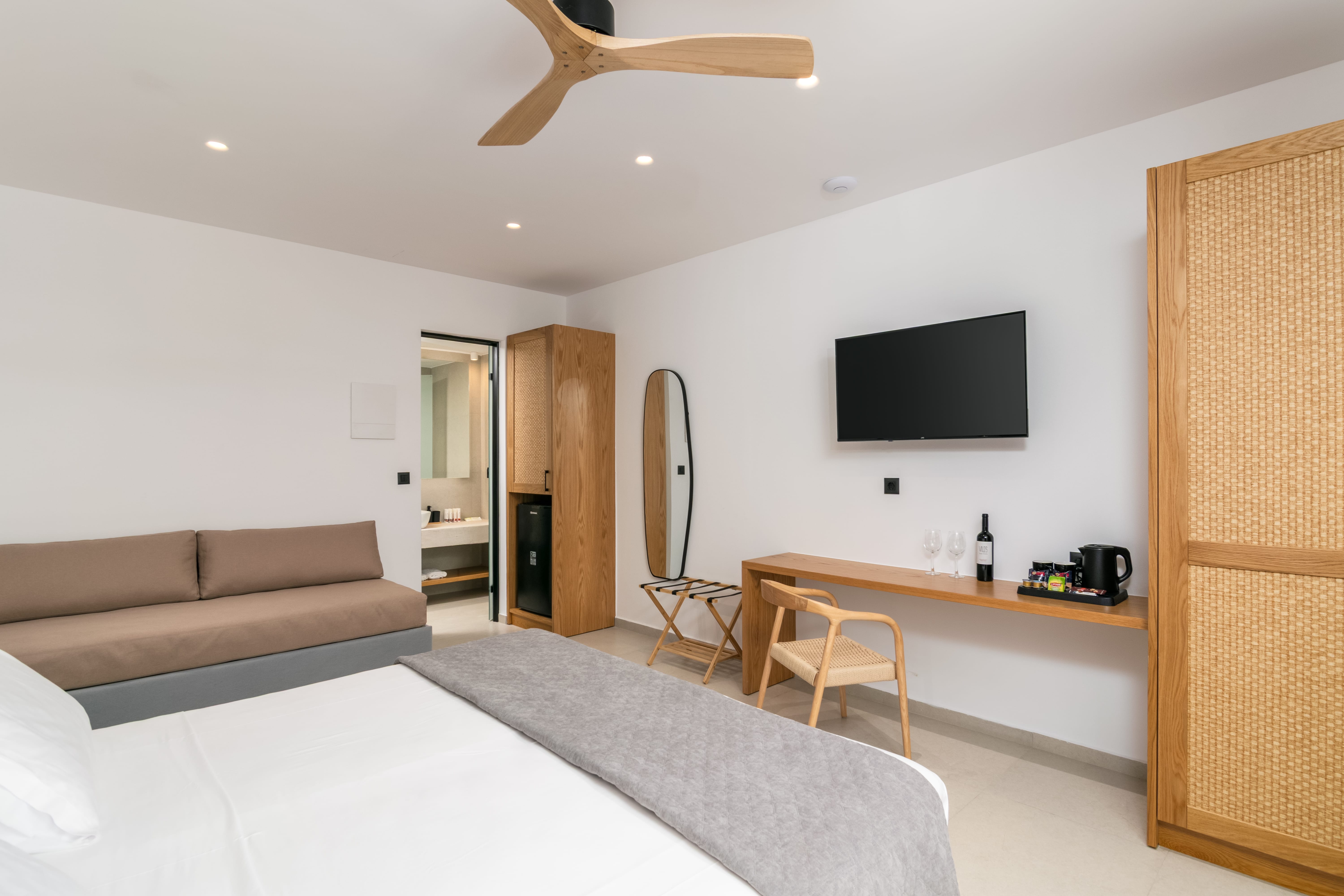 a room with a bed and a tv