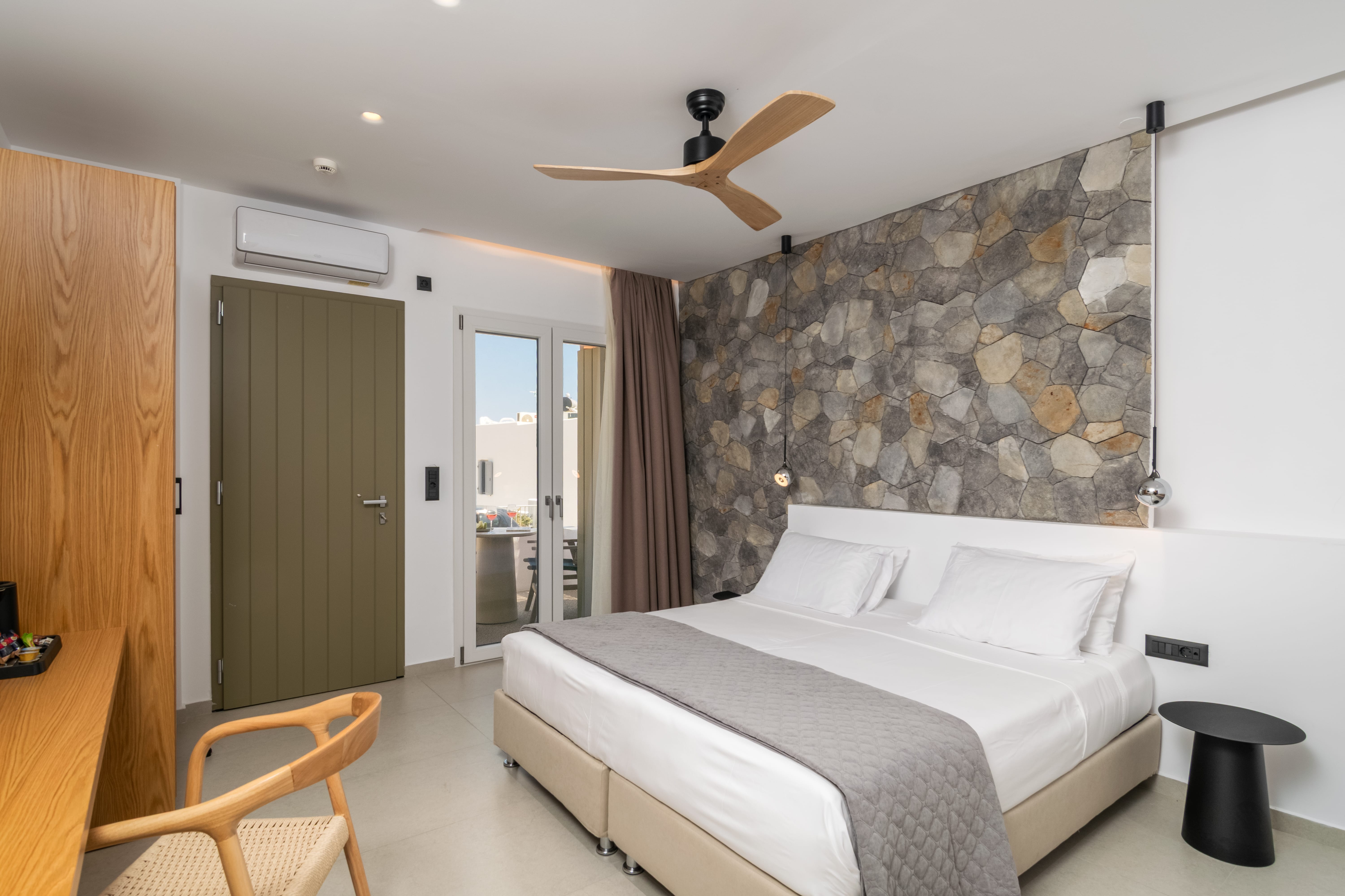 a bed with a fan in a room