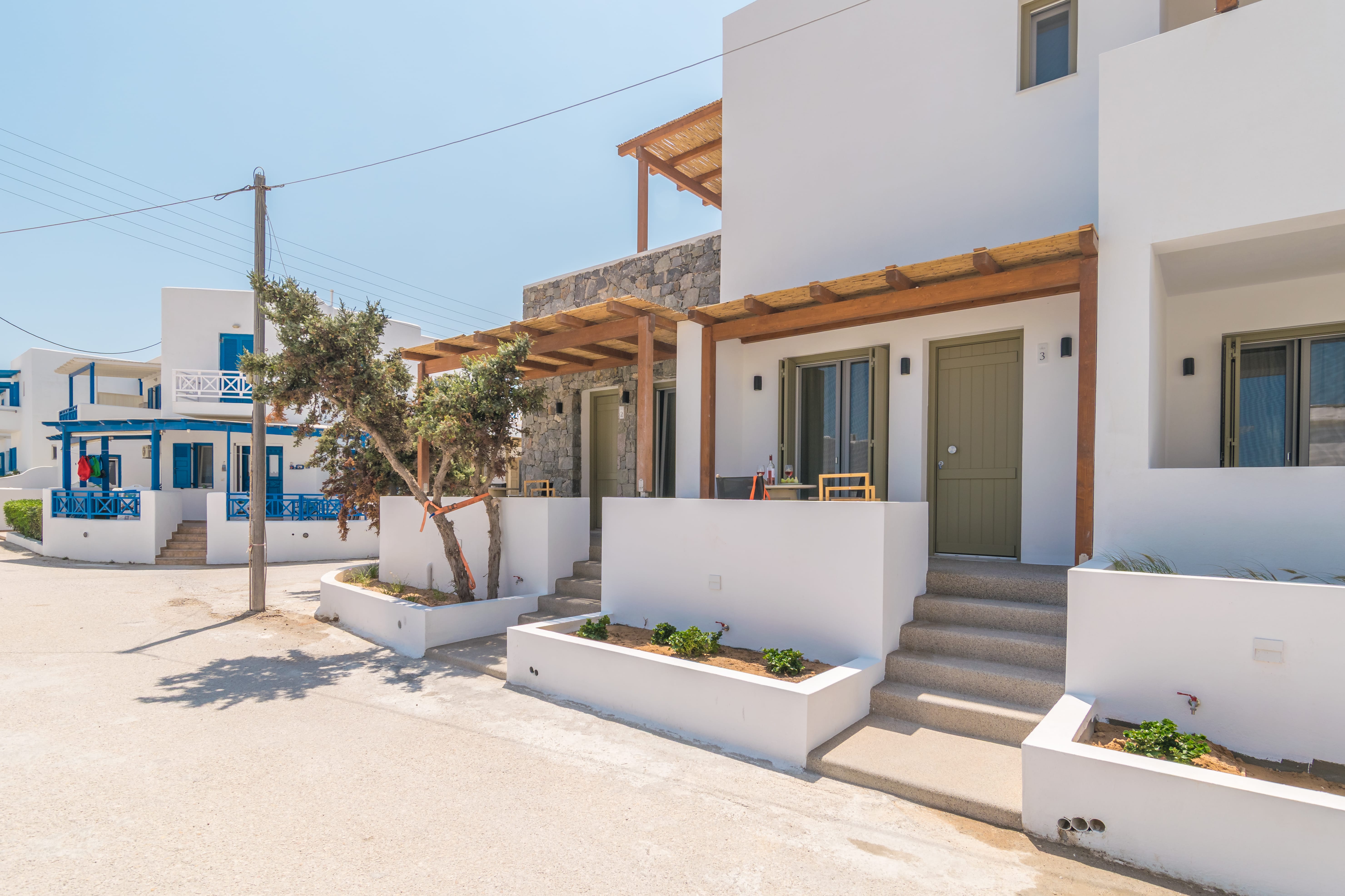 a white building with stairs and steps