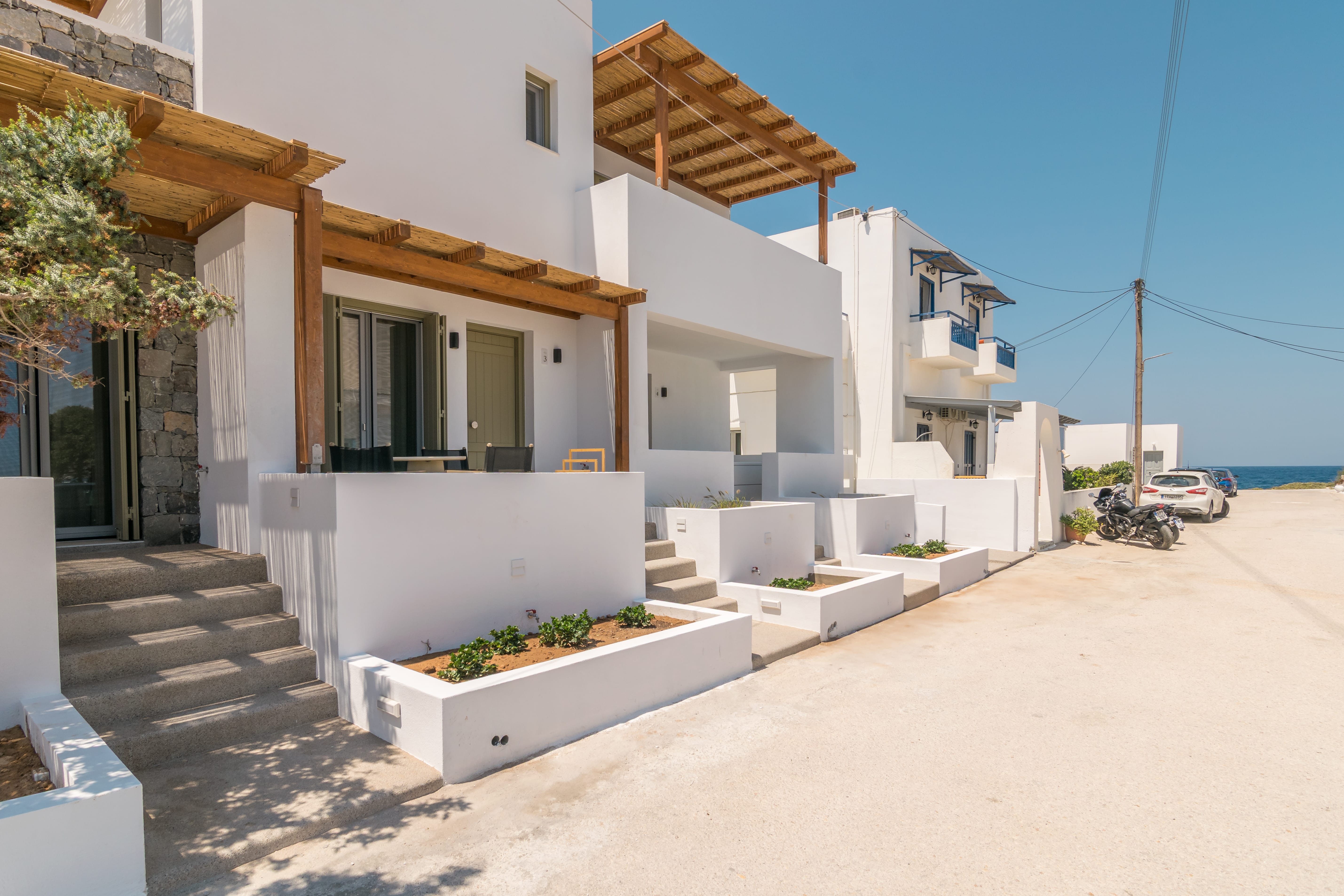 a white building with stairs and steps