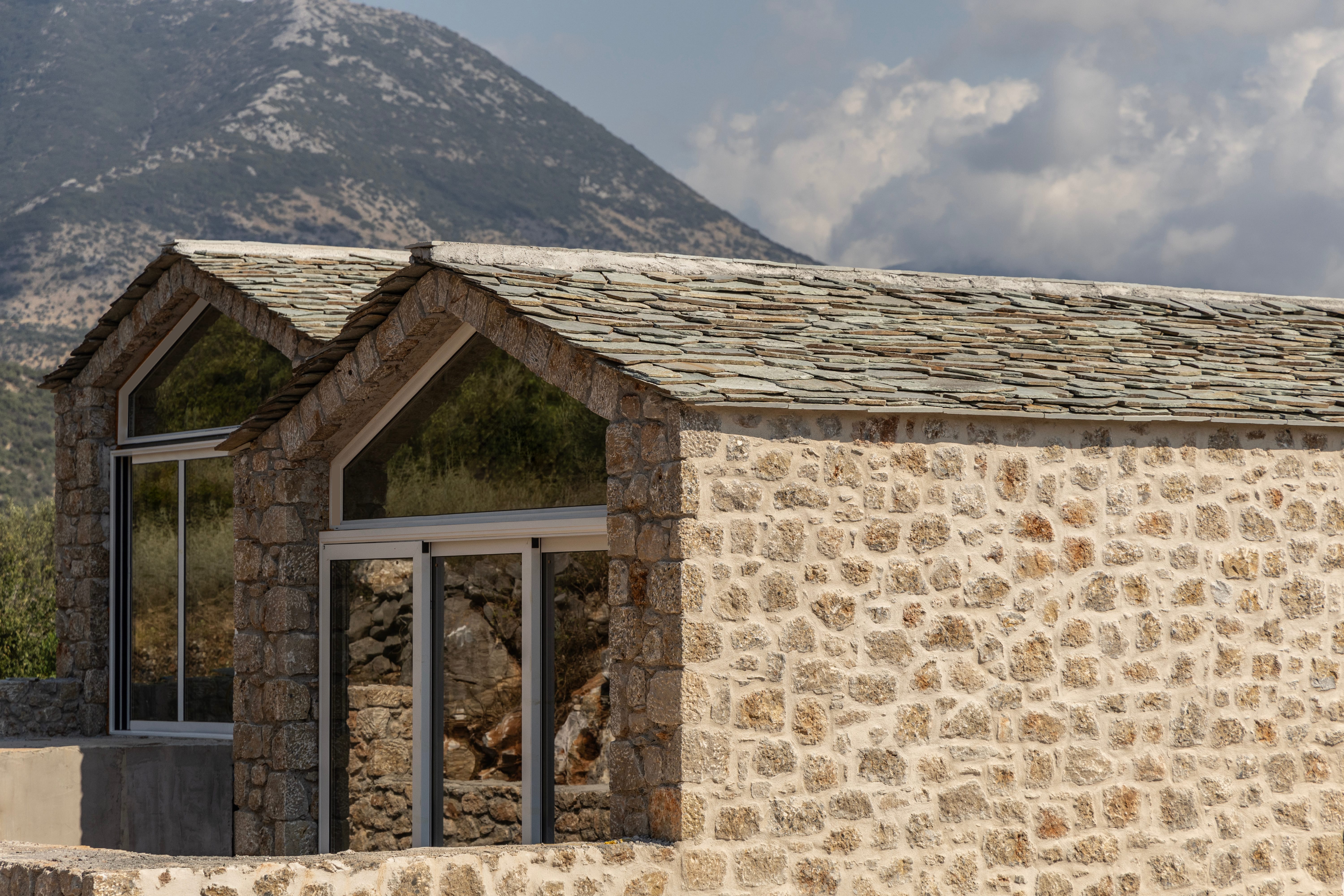a stone building with a roof