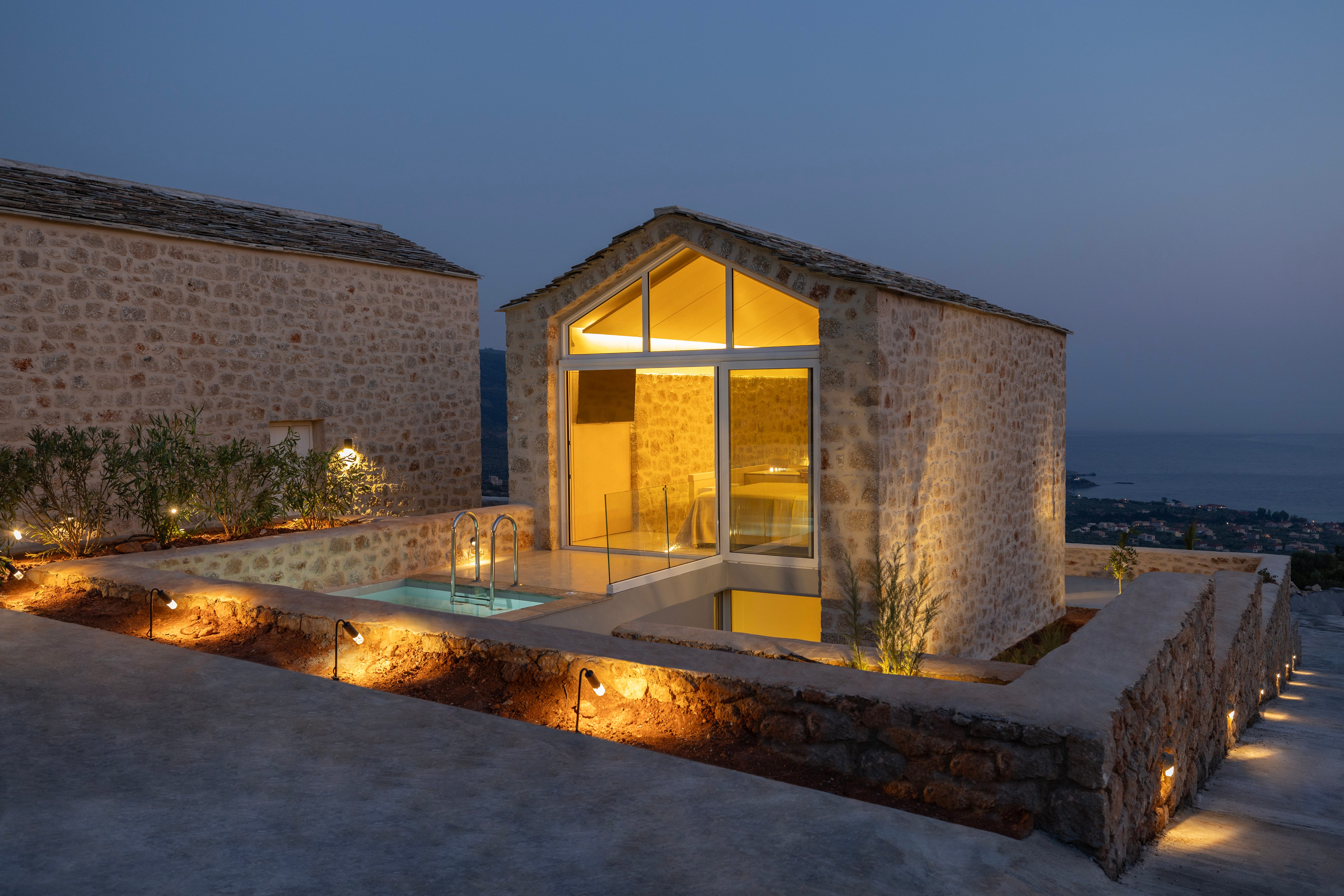a building with a pool and lights